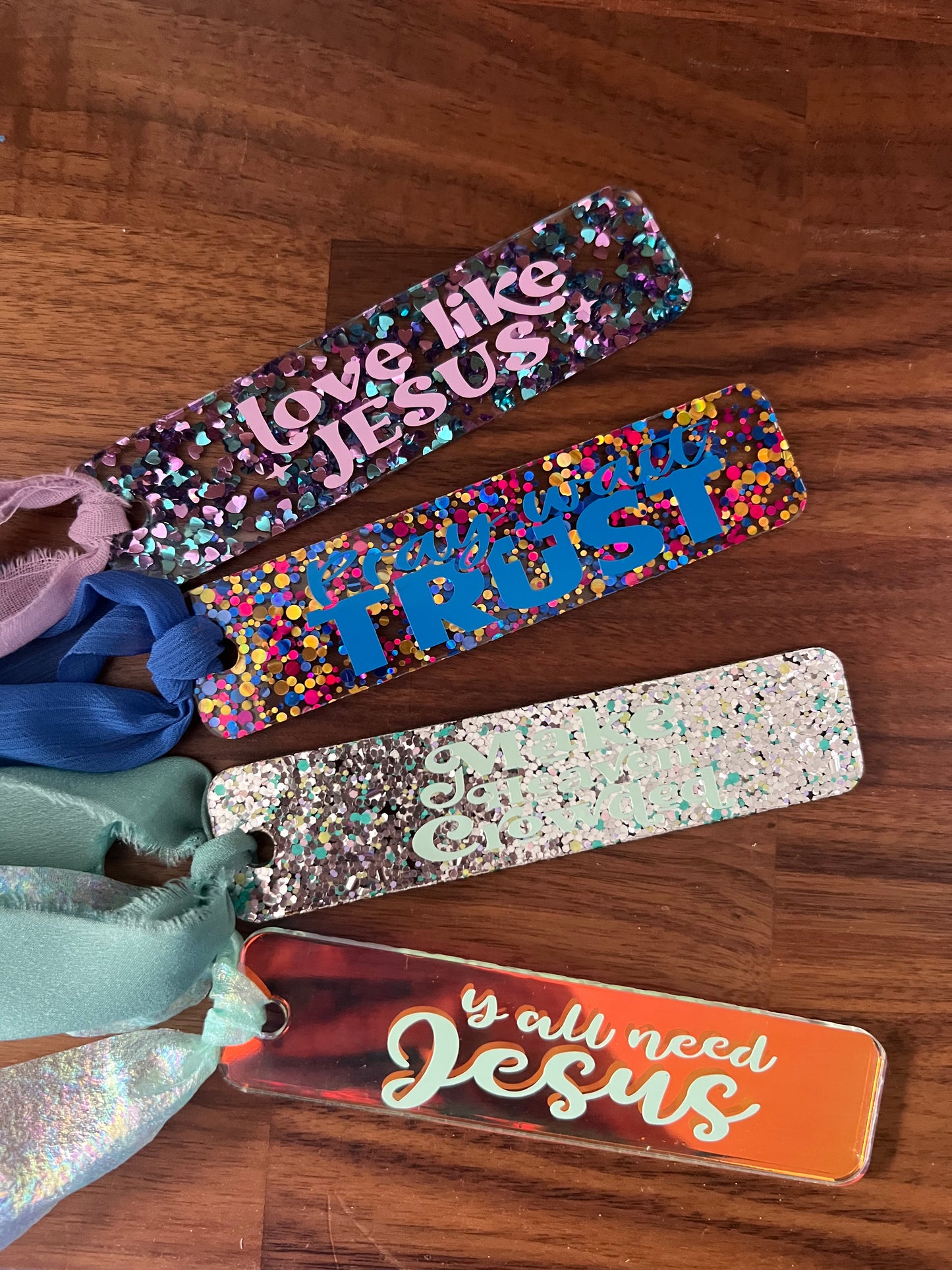 Sons & Daughters Glittering Truth acrylic bookmark with shimmering design, perfect for gift-giving or adding sparkle to reading.