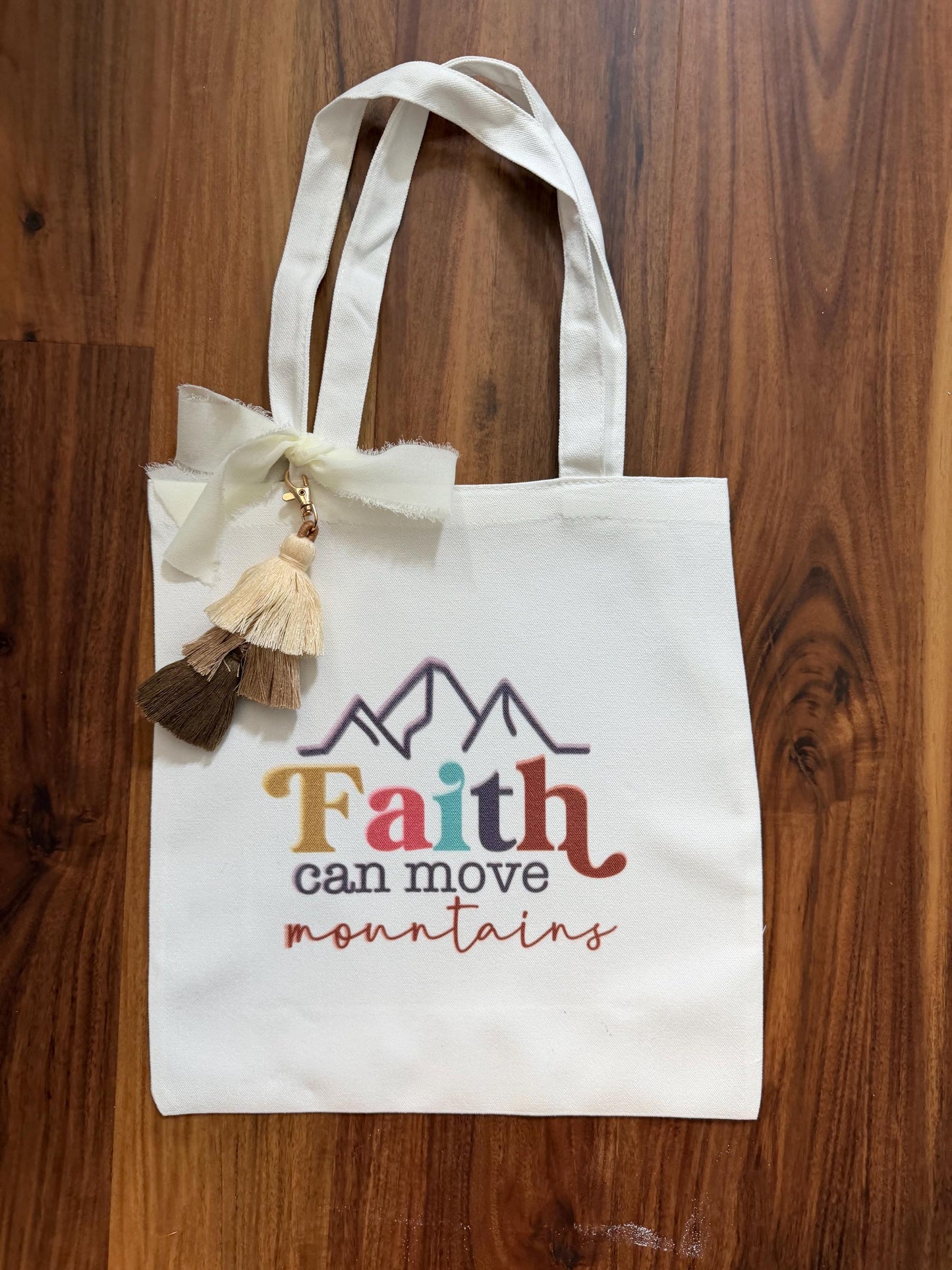 Faith tassel tote bag with vibrant mountain design, canvas Bible verse bag