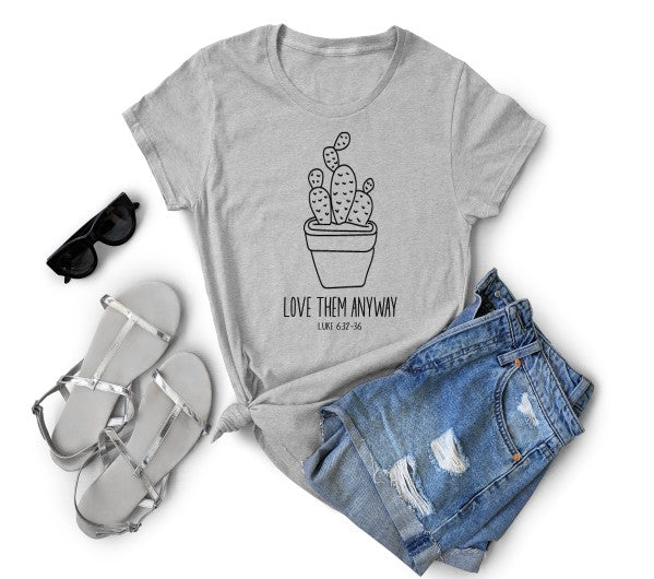 Adult T-shirt by Sons & Daughters featuring a bold "Love Them Anyway" graphic in soft fabric and comfortable fit.