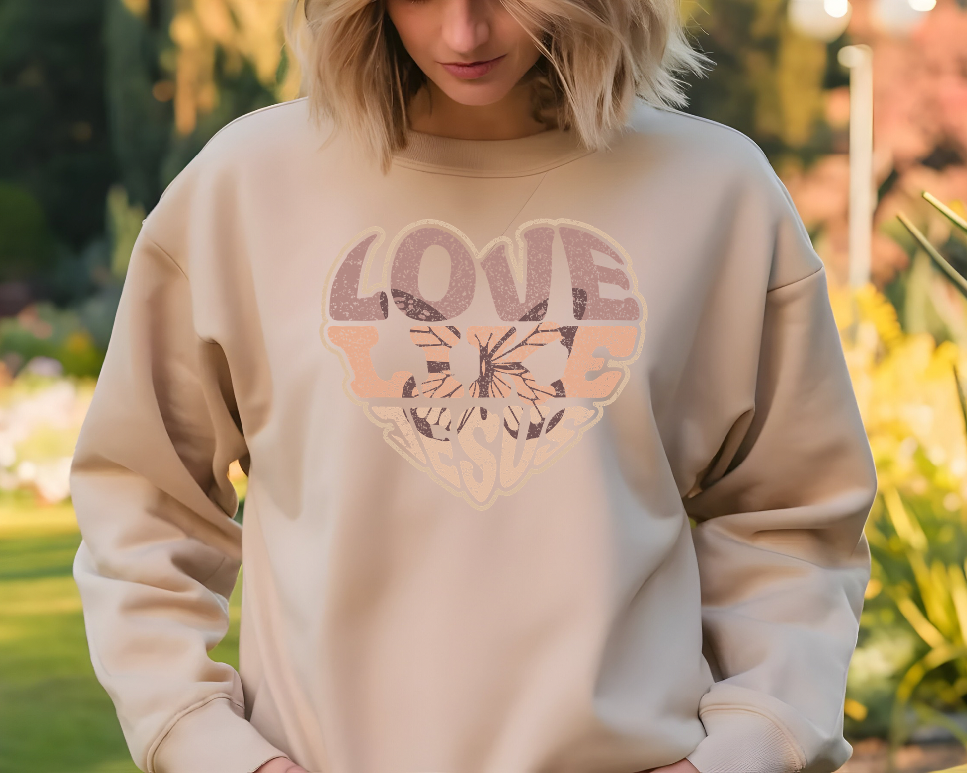 Sons & Daughters Love Like Jesus sweatshirt featuring a comfortable gray fabric with printed inspirational message.