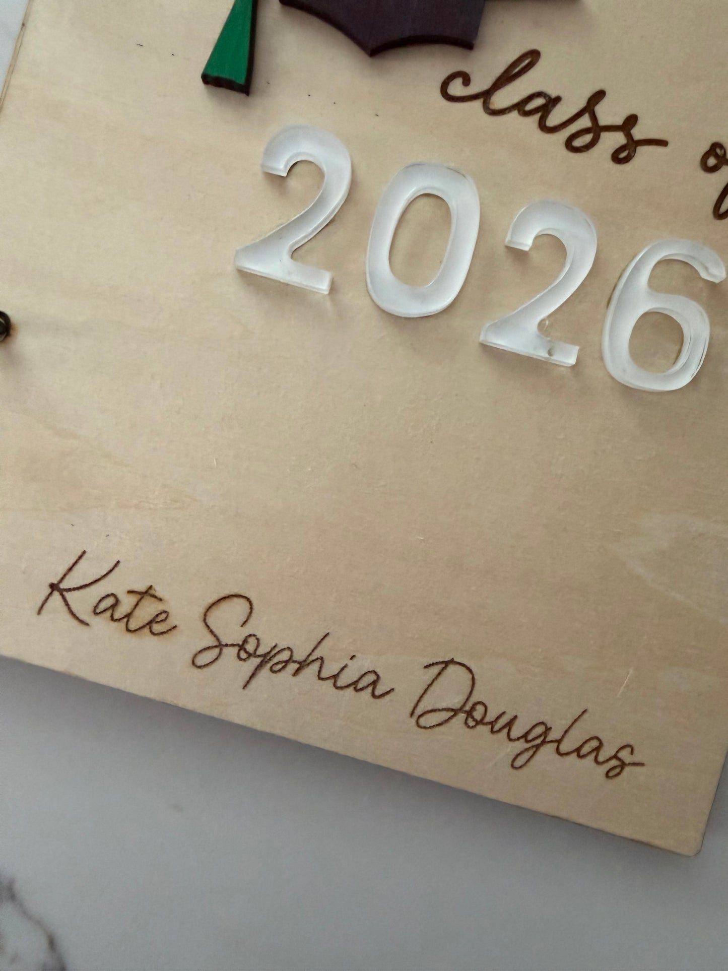 Personalized wooden graduation card holder with engraved "2026" and Bible verse option, ideal for graduation keepsake or gift.