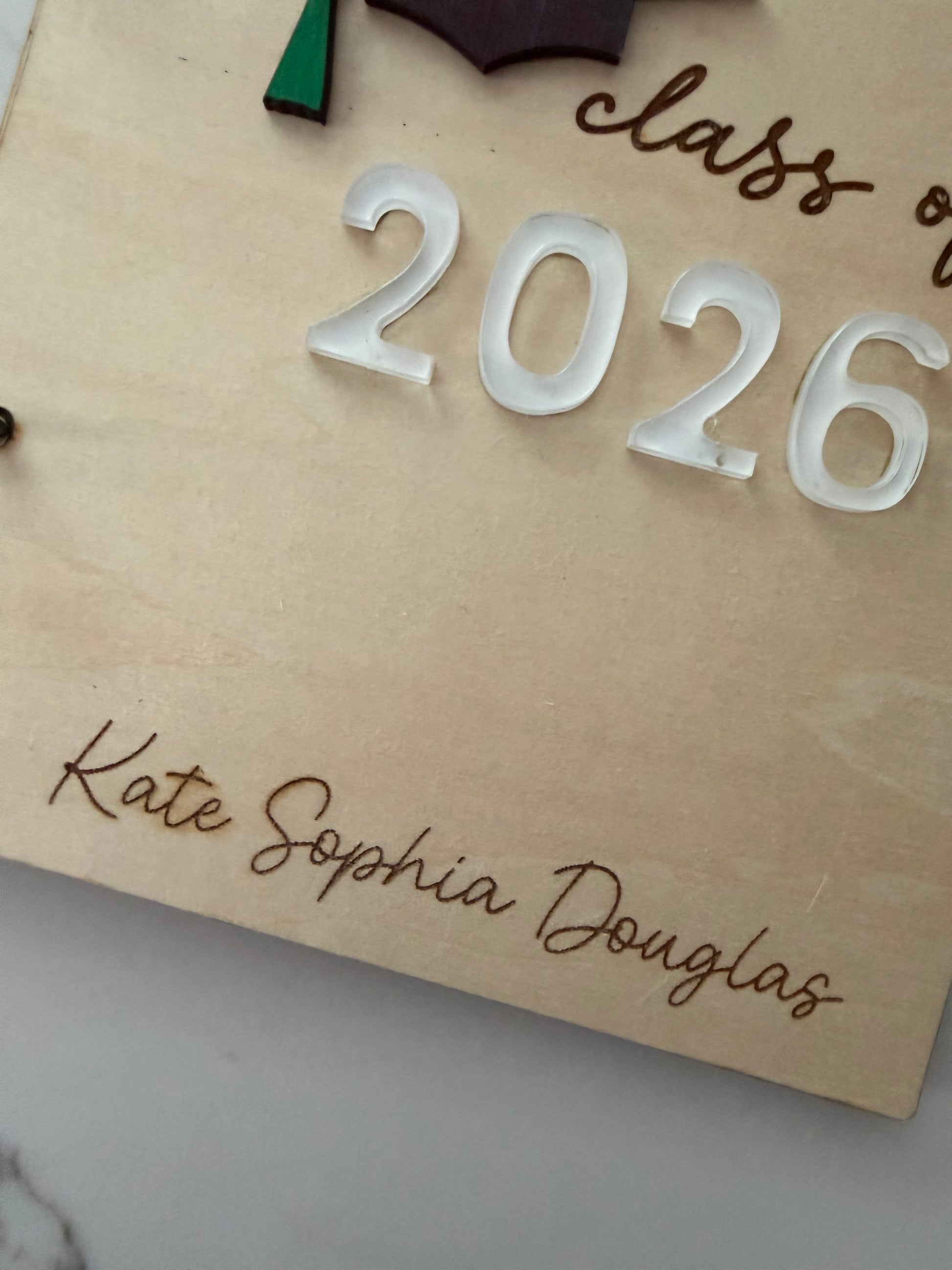 Personalized wooden graduation card holder with engraved "2026" and Bible verse option, ideal for graduation keepsake or gift.