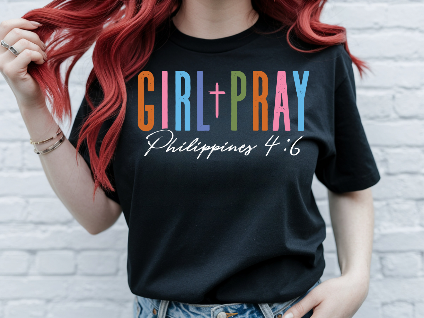 Girls pray t-shirt by Sons & Daughters featuring a peaceful girl praying graphic on a comfortable cotton tee.