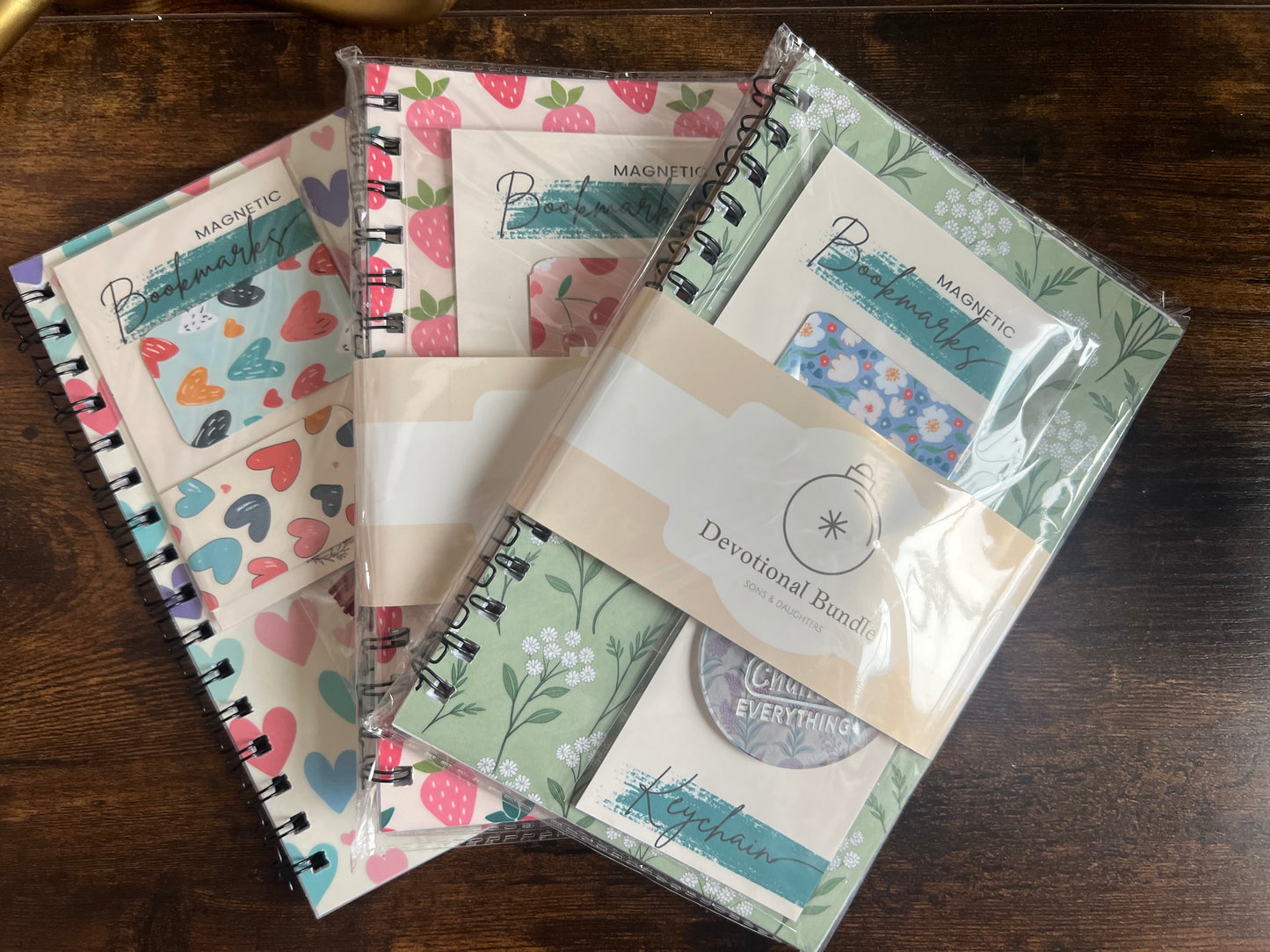 Sons & Daughters devotional bundle with books and religious materials arranged together, ideal for spiritual reflection.
