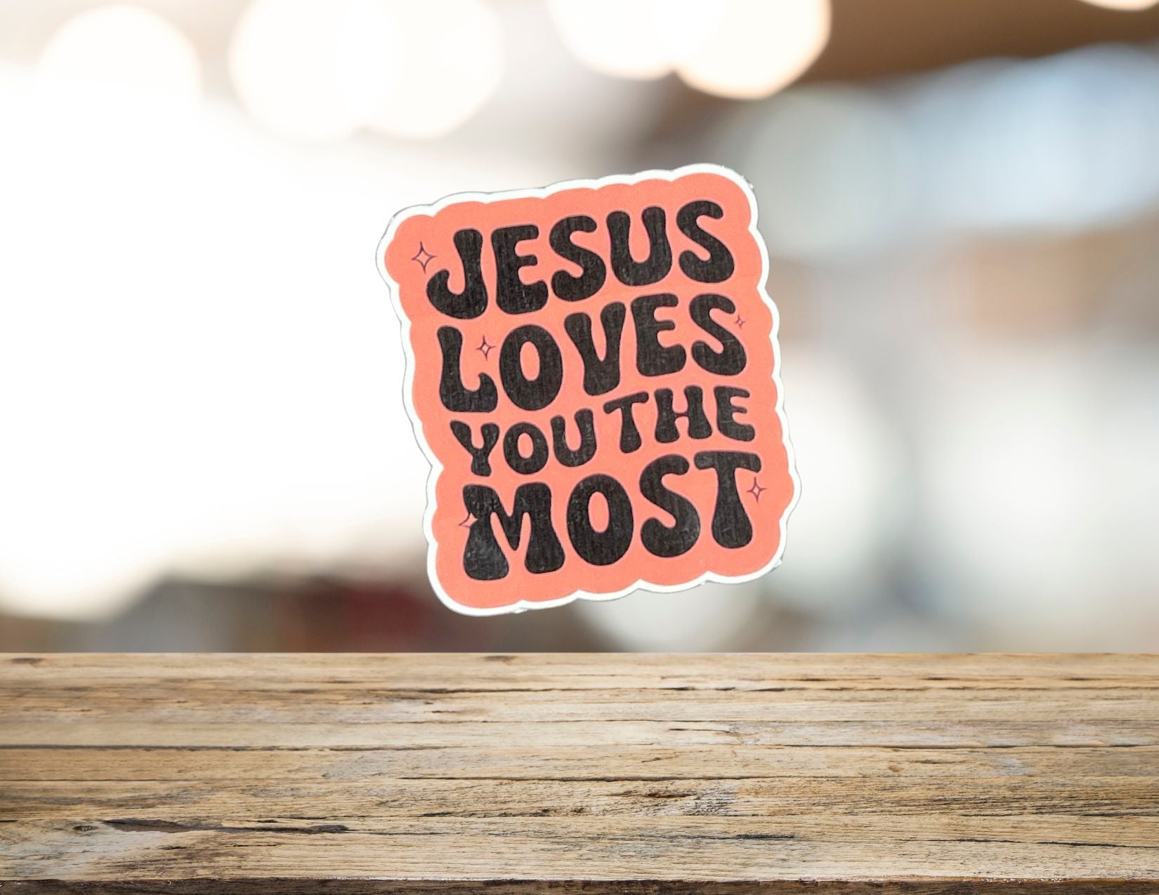 Bible verse artwork featuring "Jesus loves you the most" text on a decorative background, suitable for inspirational home decor.