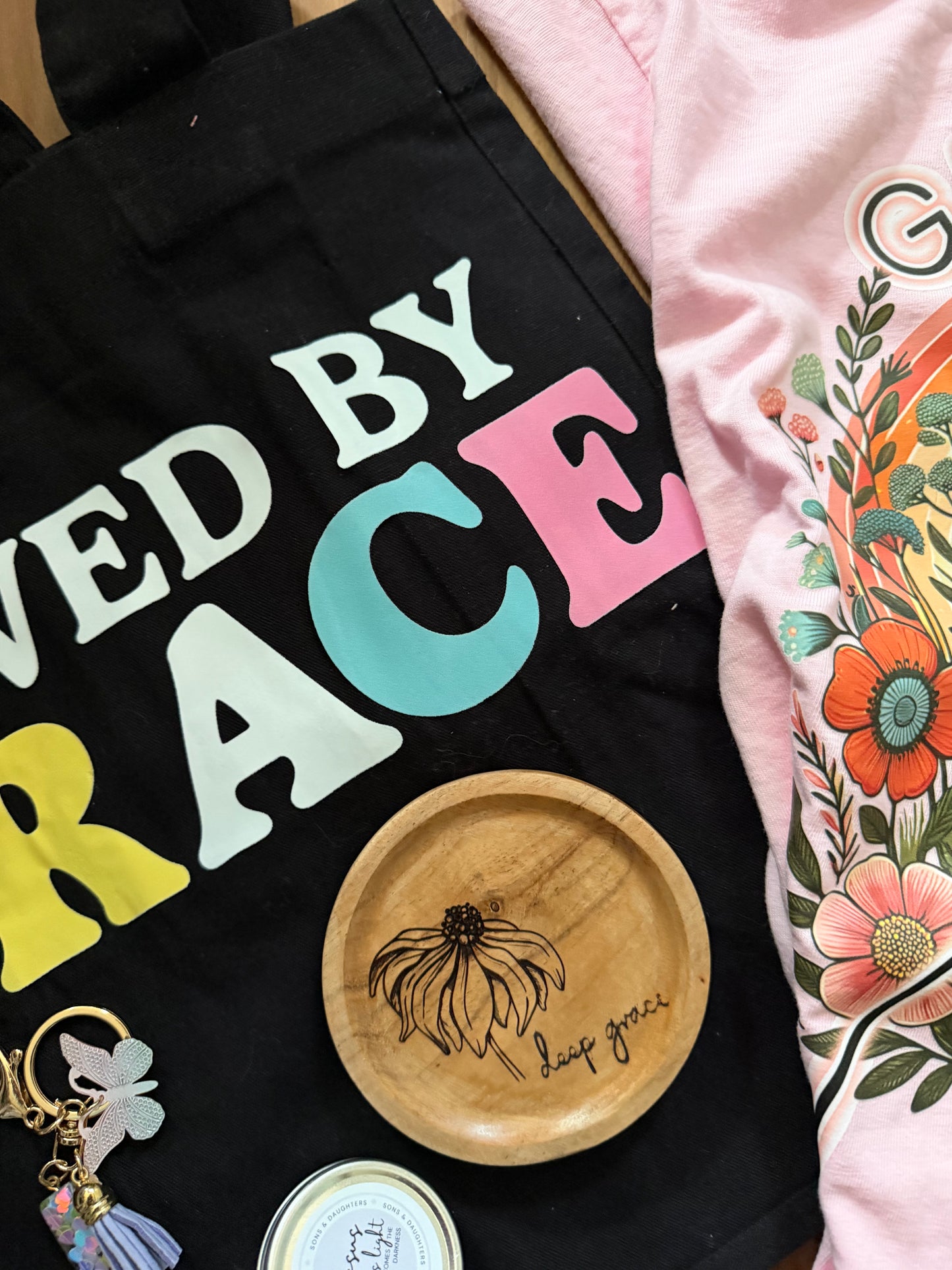 Mystery gift box with Grace theme from Sons & Daughters, including spiritual soul care kit, t-shirt, and bag.