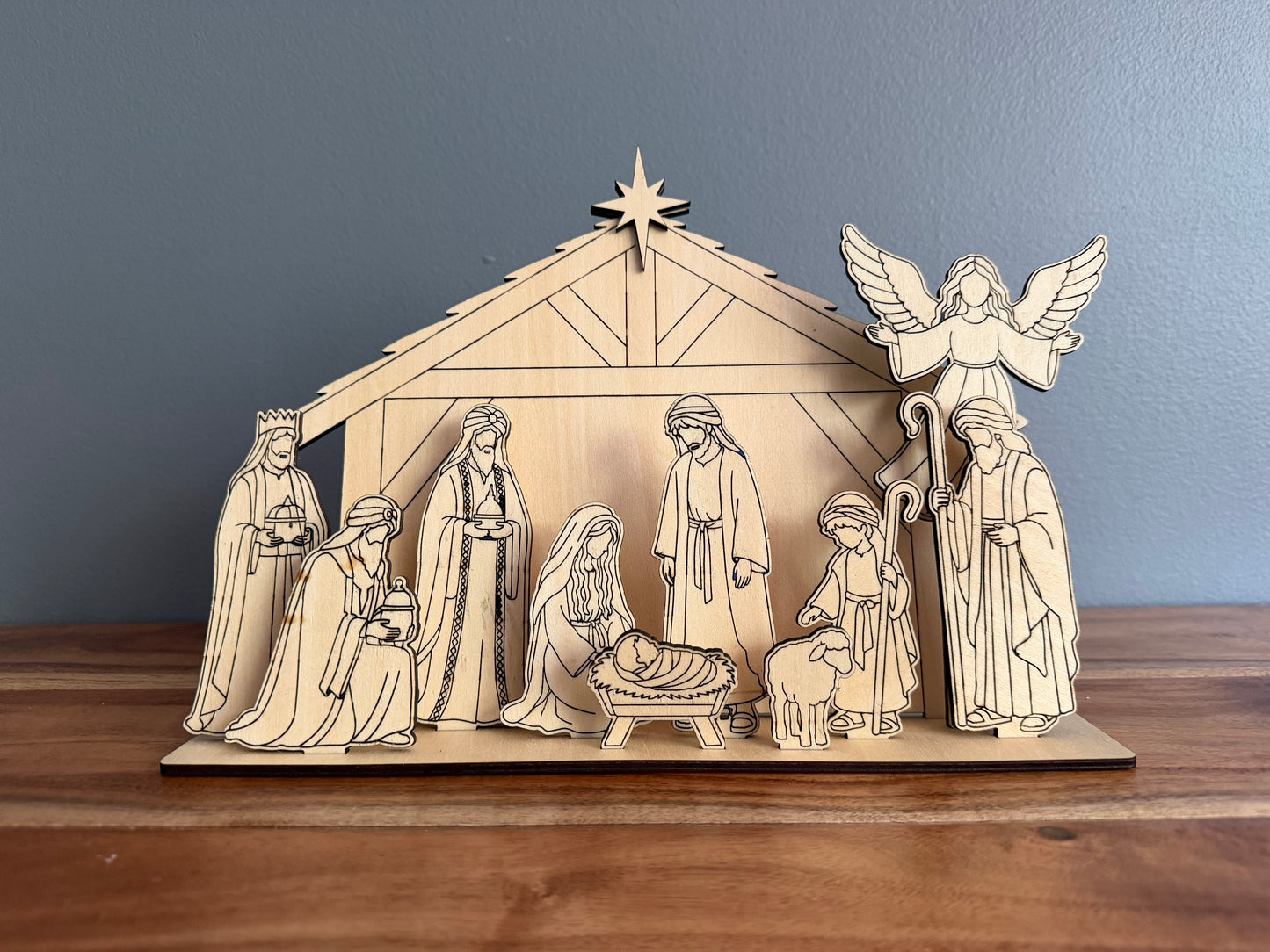 DIY wooden nativity craft kit by Sons & Daughters featuring painted nativity scene for kids, perfect Christian Christmas family activity.
