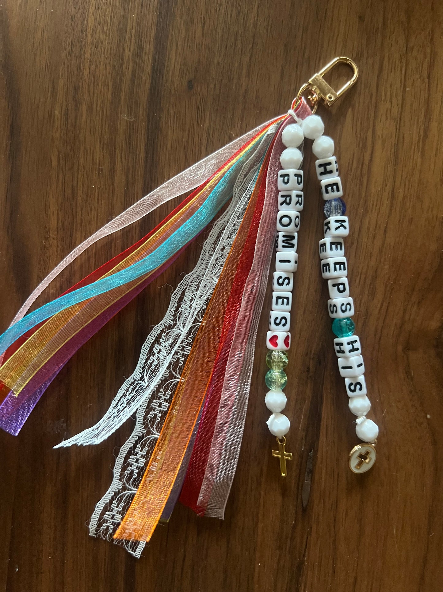 Colorful Sons & Daughters "He keeps His promises" keychain with engraved text and metal keyring, vibrant and durable.