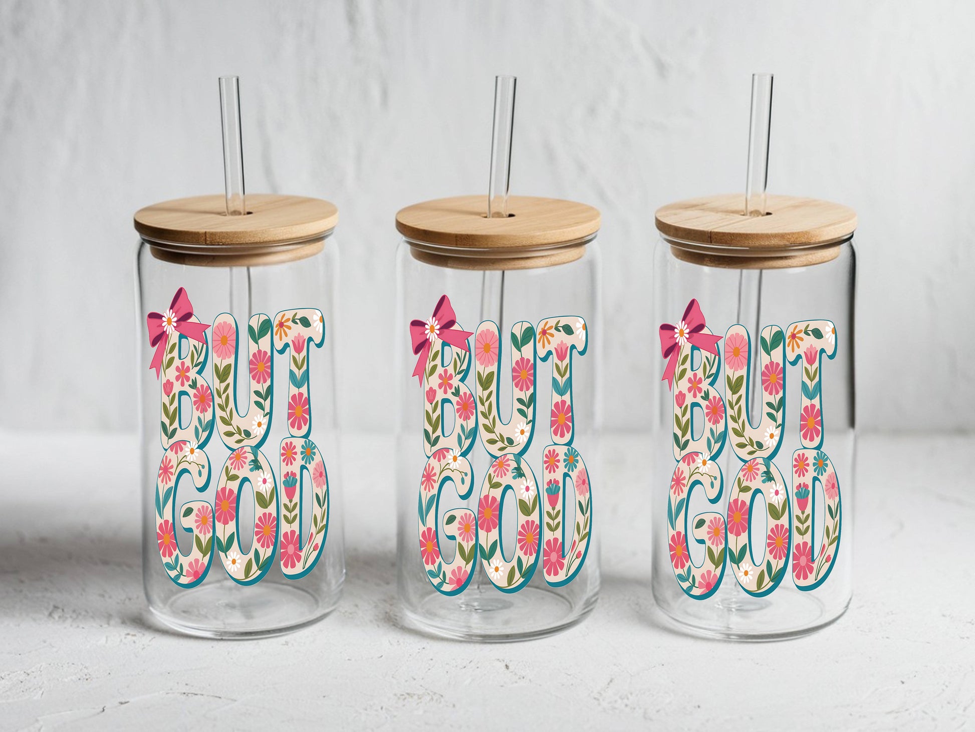 16 oz glass tumbler with floral "God" design, bamboo lid, and reusable straw from Sons & Daughters.