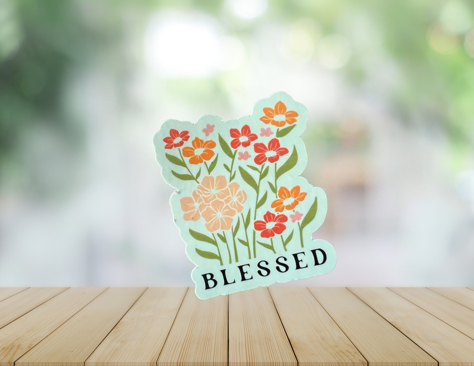 Blessed Sons & Daughters graphic T-shirt featuring a bold "Blessed" print on black cotton fabric.