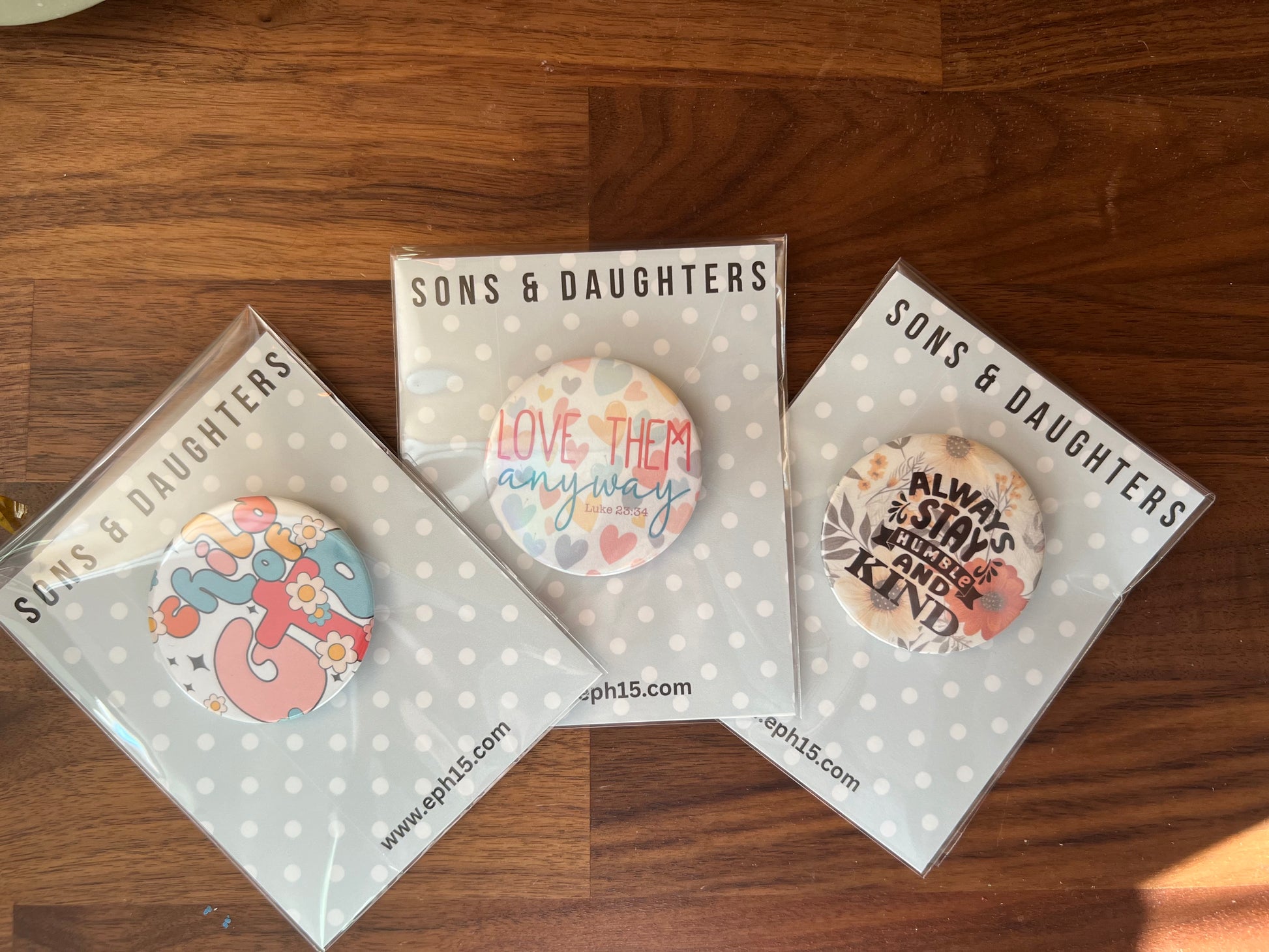Sons & Daughters Button of Faith accessory featuring a faithful message flare, showcasing a small decorative pin with inspirational design.