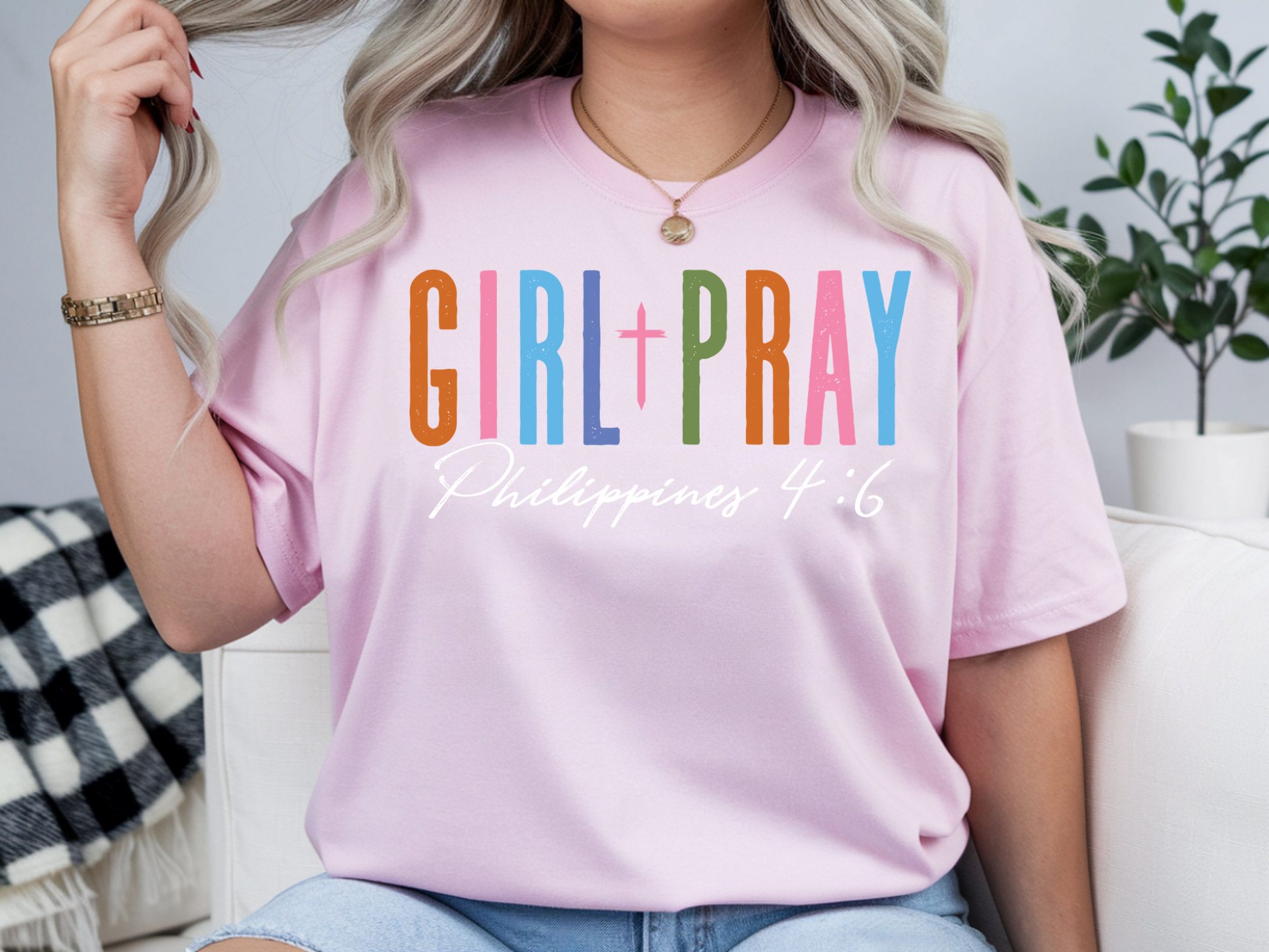 Sons & Daughters girl pray t-shirt featuring a girl praying with a peaceful expression and simple design on a white background.
