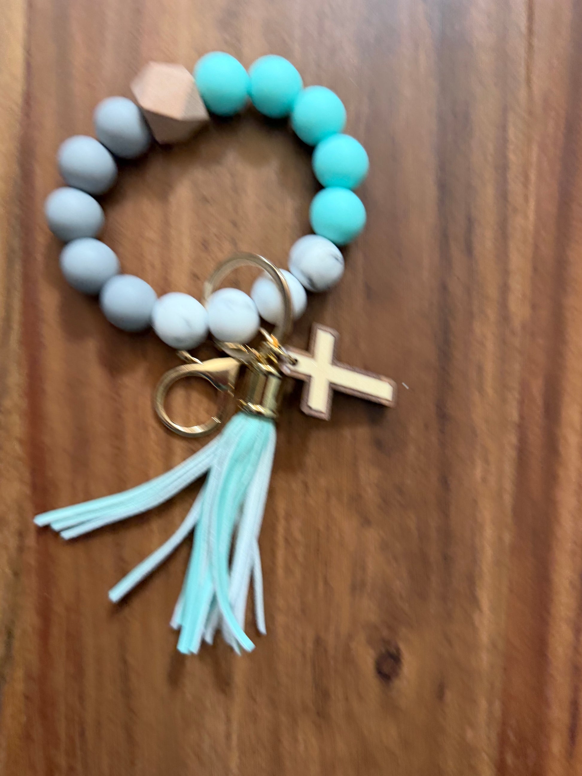 Silicone cross bracelet keychain accessories by Sons & Daughters, featuring colorful cross charms on durable silicone bands.