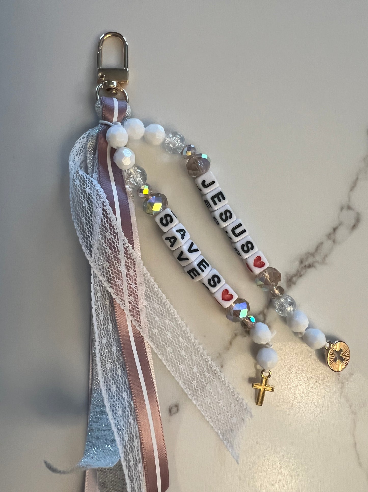 Whimsical Jesus saves keychain by Sons & Daughters featuring a colorful, playful Jesus design on a metal keyring.