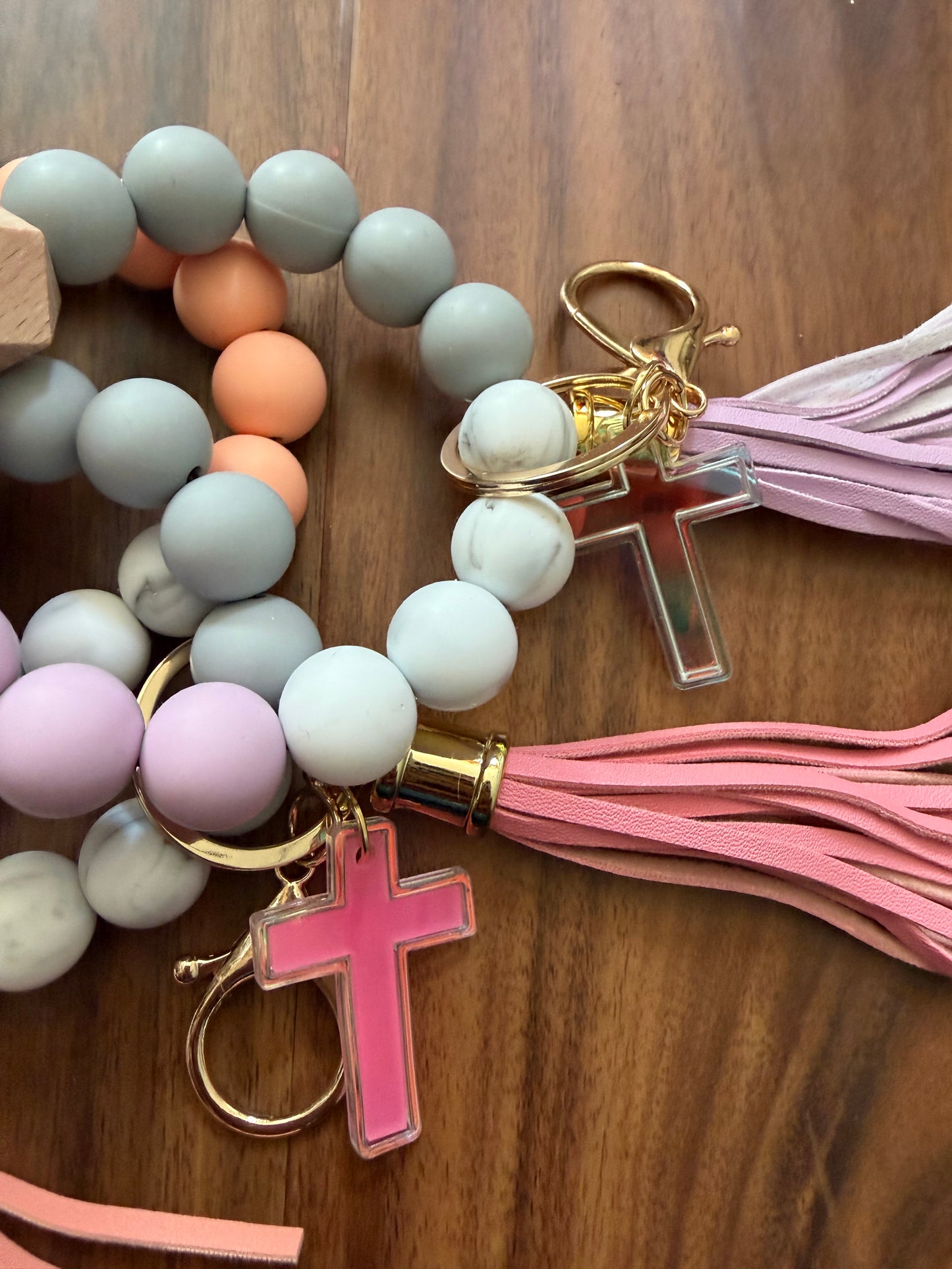 Silicone cross bracelet keychain by Sons & Daughters, durable accessories with a religious cross design on a keyring.