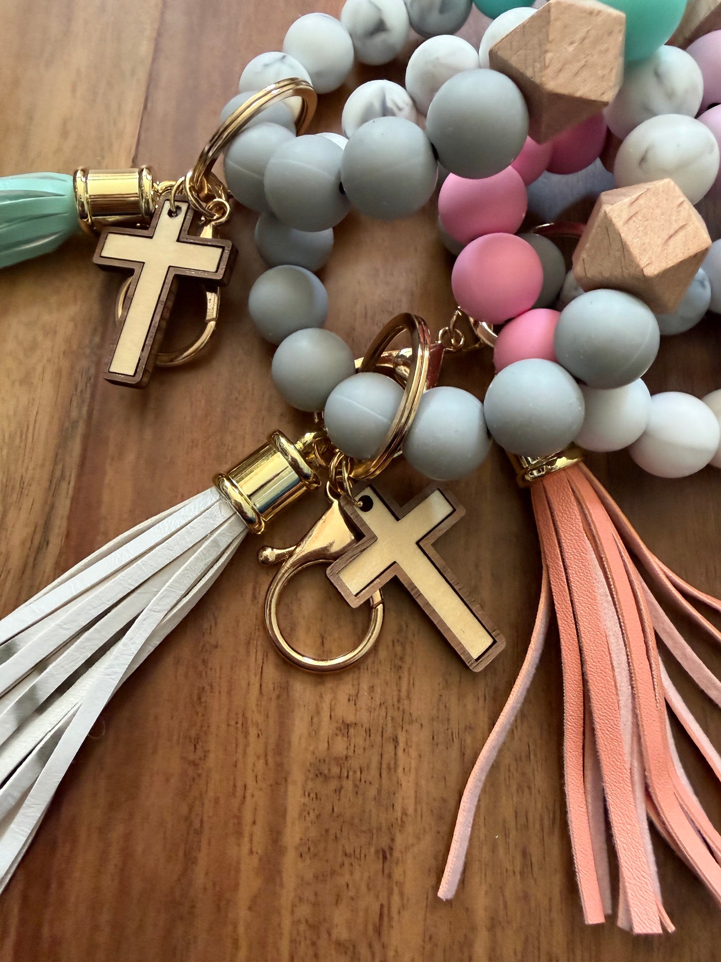 Colorful silicone cross bracelet keychain, Sons & Daughters accessories with durable, vibrant design for everyday use.