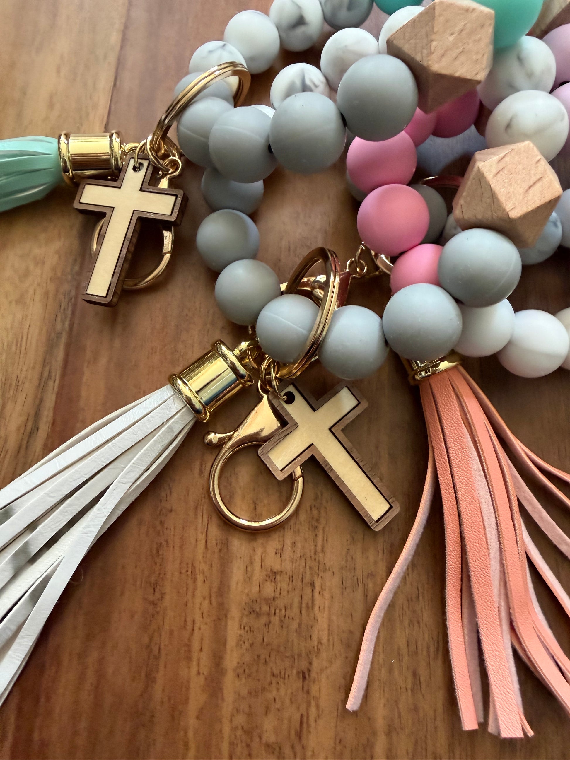 Colorful silicone cross bracelet keychain, Sons & Daughters accessories with durable, vibrant design for everyday use.