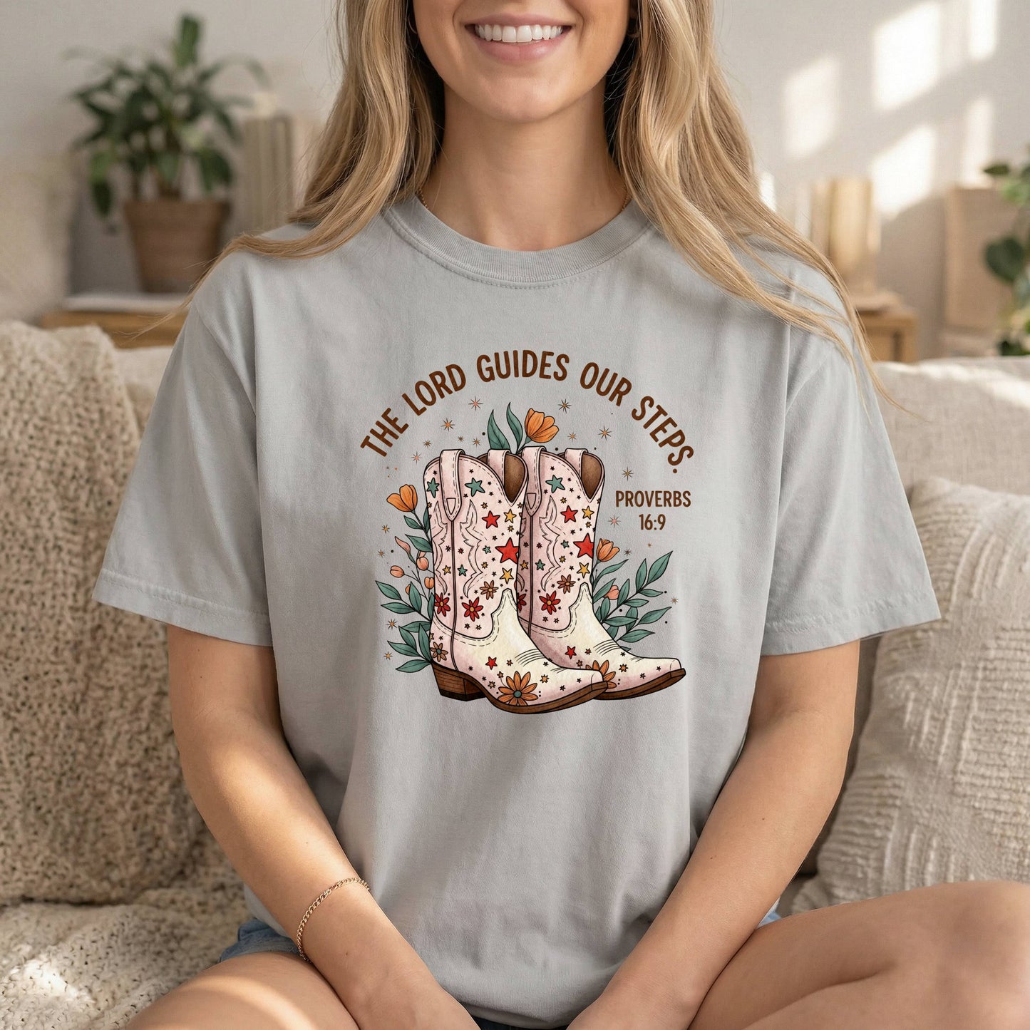 Comfort Colors cowgirl T-shirt with Proverbs 16:9 Bible verse and boots graphic, inspirational religious tee for women by Sons & Daughters