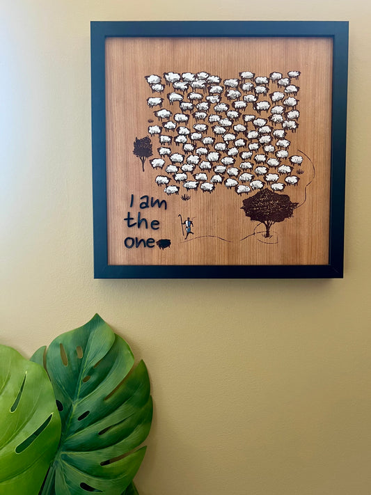 Framed picture with the phrase "I am the one" by Sons & Daughters, featuring modern typography on a clean background.