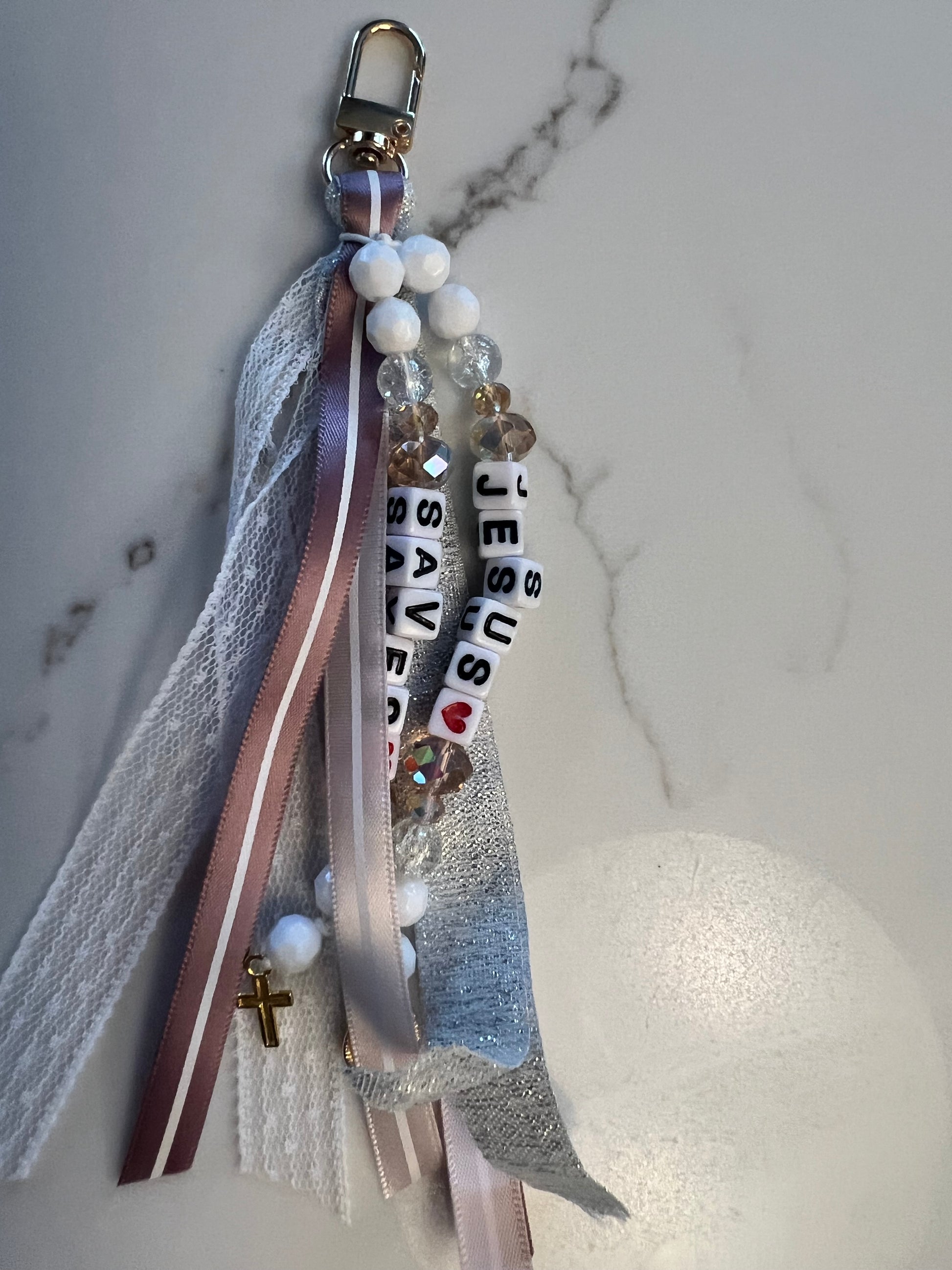 Whimsical Jesus saves keychain by Sons & Daughters featuring a colorful Jesus figure on a metal keyring.