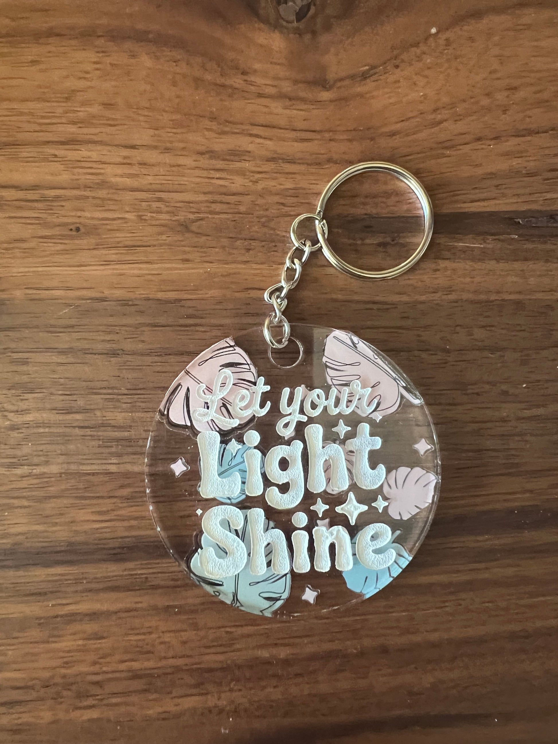 Sons & Daughters Kingdom keychain bag tag featuring a detailed crown and ornate design on a metal keyring.