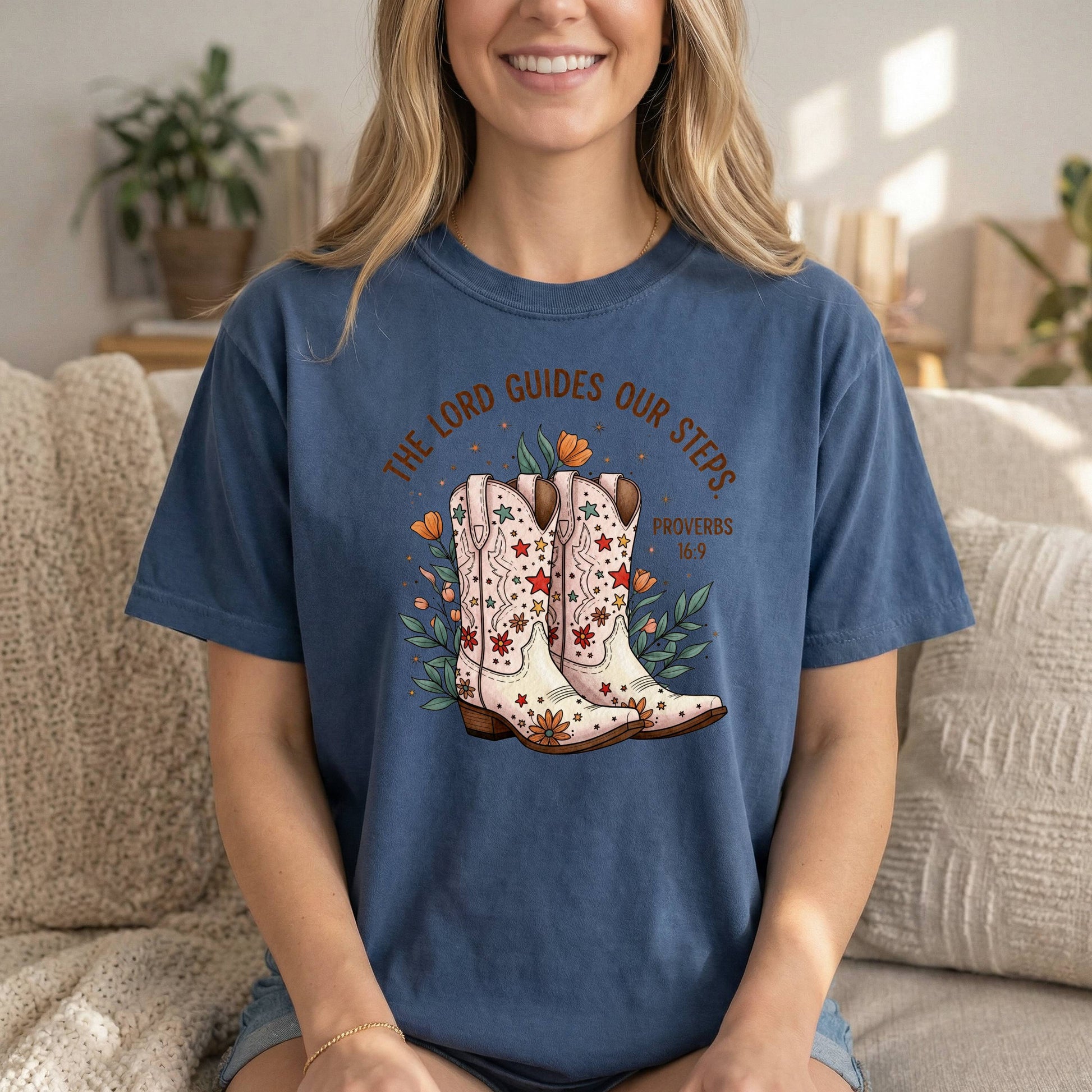 Comfort Colors cowgirl T-shirt by Sons & Daughters with denim front boot print and Proverbs 16:9 Bible verse for women.