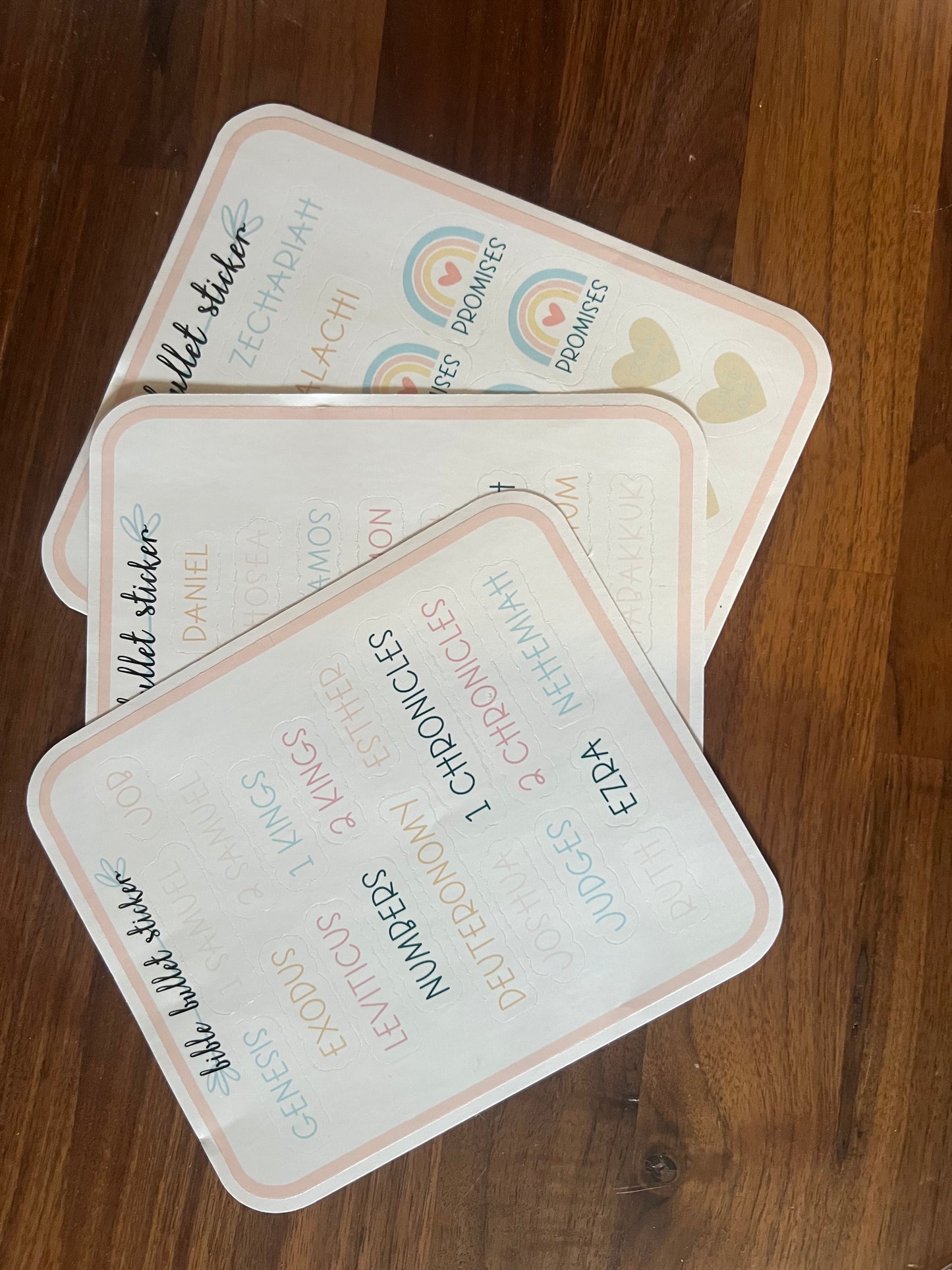 Clear Old Testament books journaling stickers by Sons & Daughters featuring biblical book designs on transparent sticker sheets.