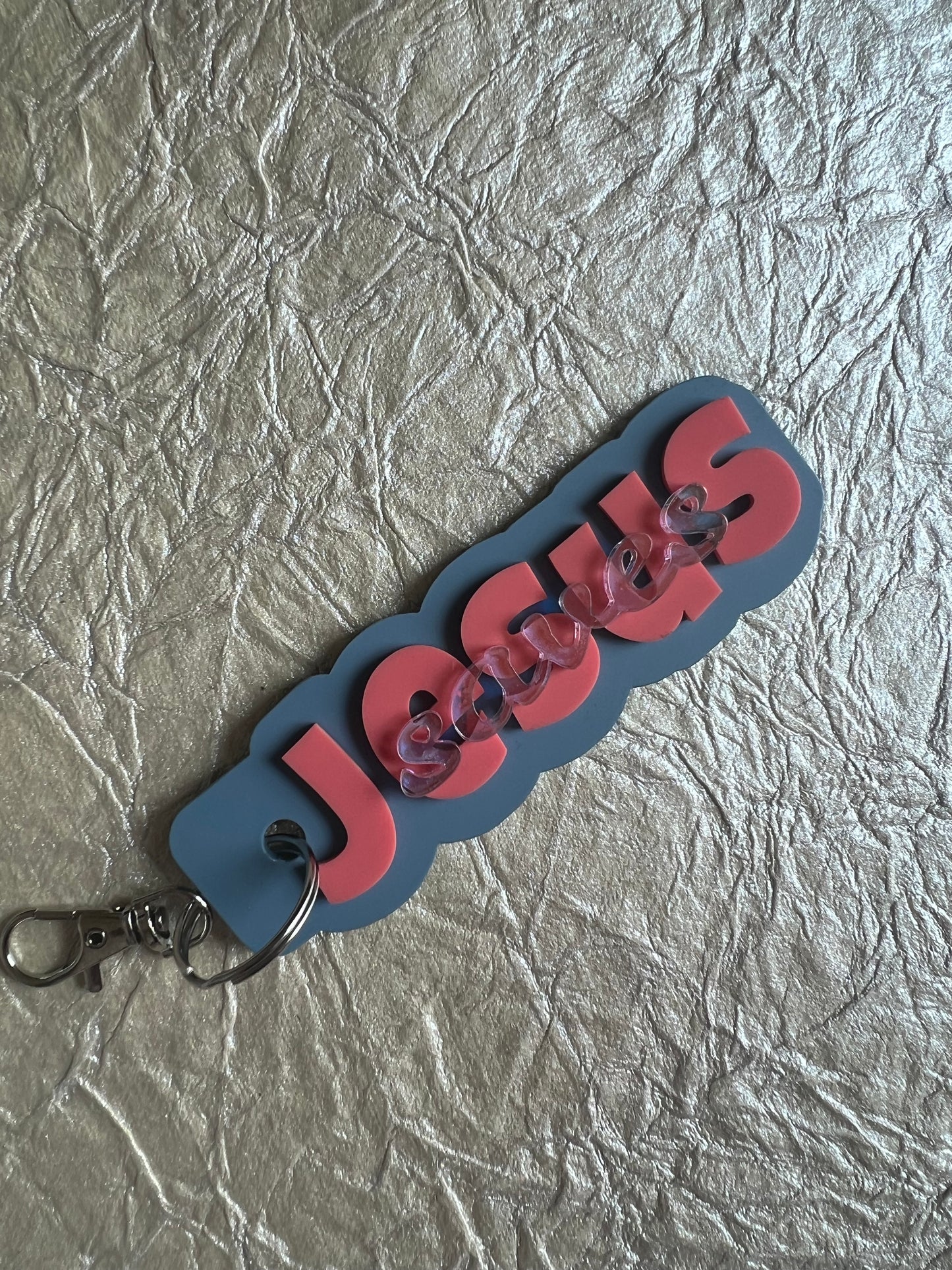 Sons & Daughters Jesus Saves tag featuring a Christian message, made of metal with a rustic finish and engraved text.