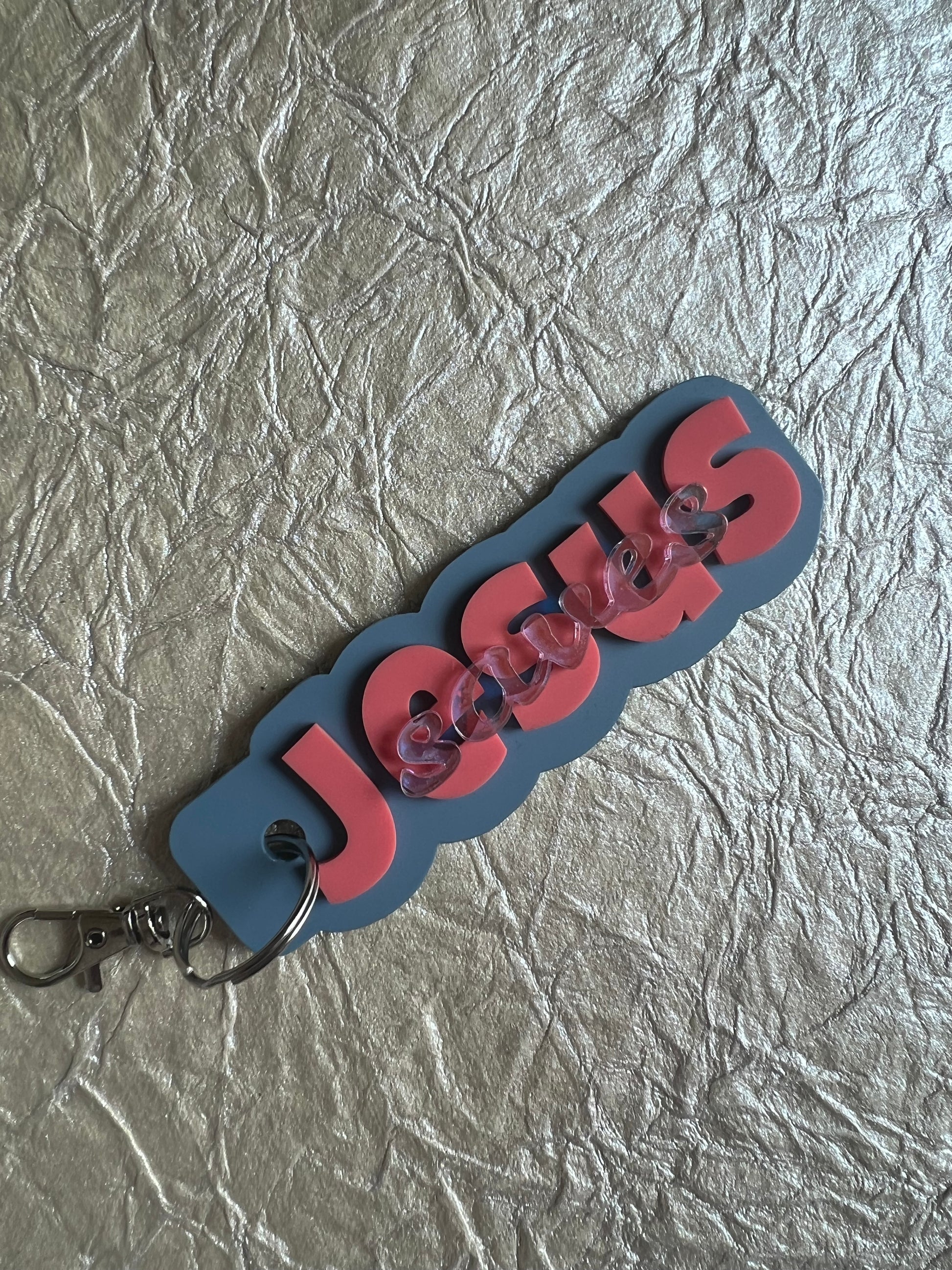 Sons & Daughters Jesus Saves tag featuring a Christian message, made of metal with a rustic finish and engraved text.