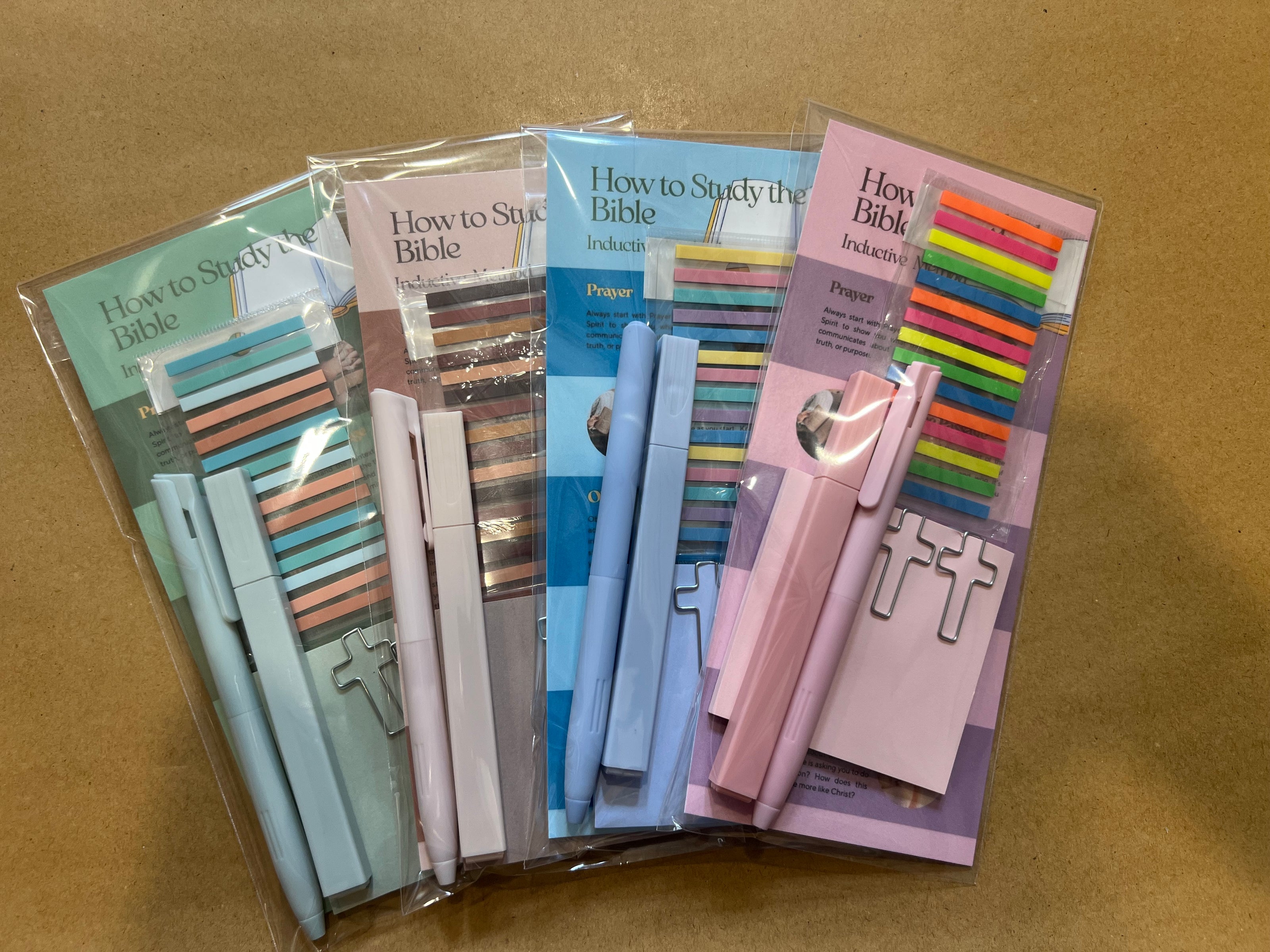 Sons & Daughters inductive Bible study kit with stationery including notebooks, pens, and study guides for in-depth Bible learning.