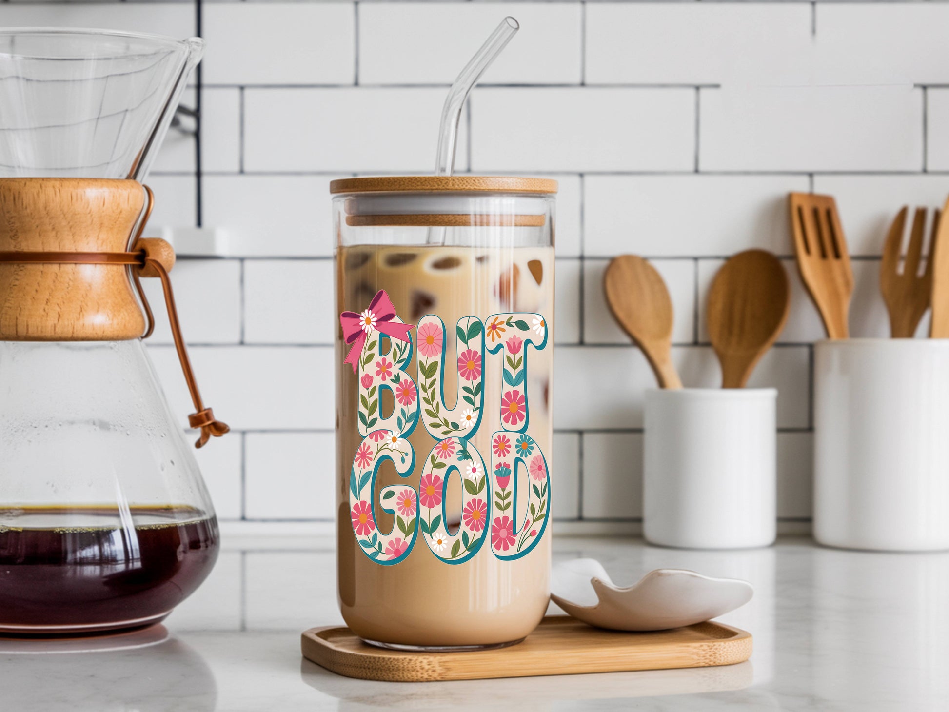 16 oz glass tumbler with floral "God" design, bamboo lid, and reusable straw by Sons & Daughters.
