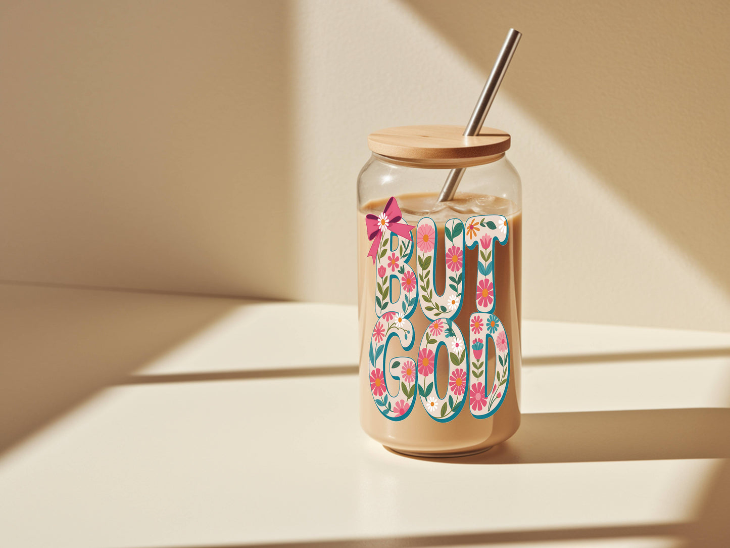 16 oz glass tumbler with floral "God" design, bamboo lid, and reusable straw by Sons & Daughters.
