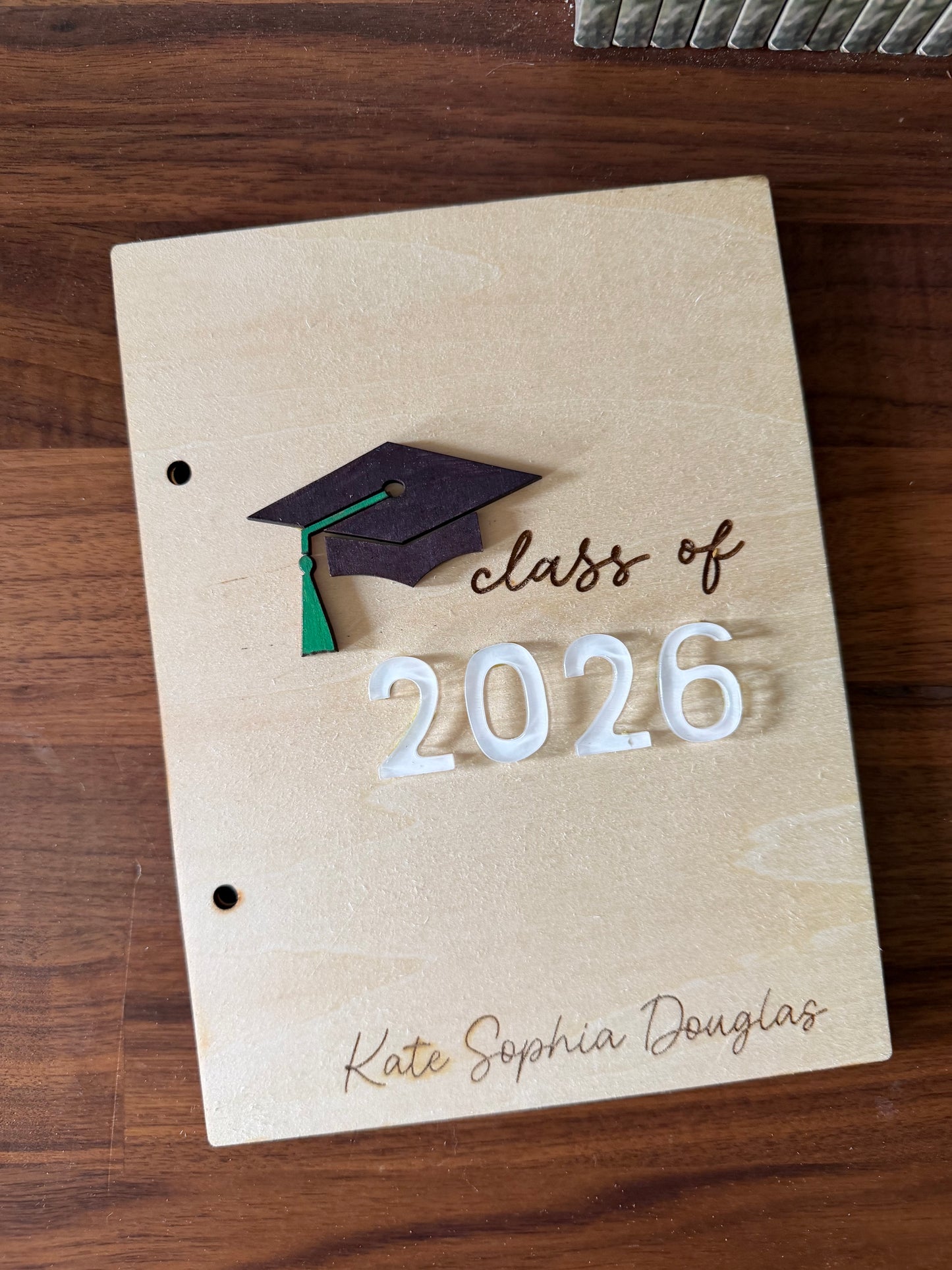 Personalized wooden graduation card holder with engraved "2026" and Bible verse option, a custom keepsake gift for graduates by Sons & Daughters.