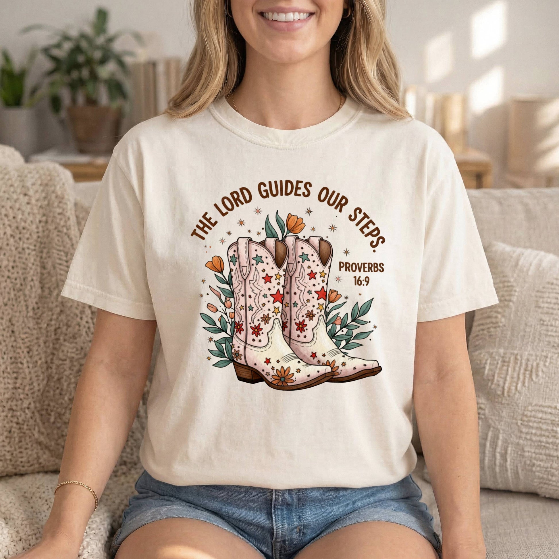 Comfort Colors cowgirl T-shirt with Proverbs 16:9 Bible verse and cowgirl boots graphic, inspirational religious tee for women.