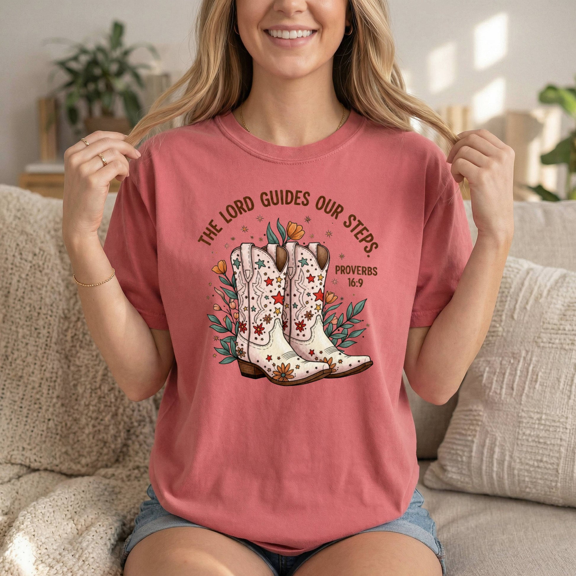 Comfort Colors Cowgirl T-Shirt for women featuring Proverbs 16:9 Bible verse with rose and boots design, spiritual and inspirational.