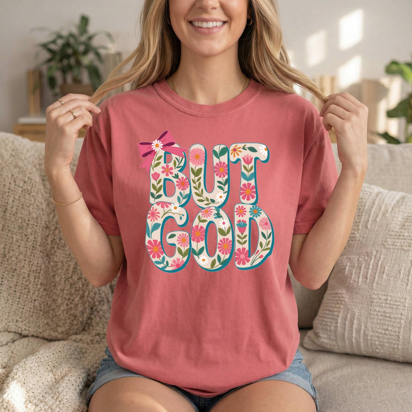 Front view of Sons & Daughters floral Christian T-shirt with "But God" quote, soft cotton fabric, inspirational Bible verse design.