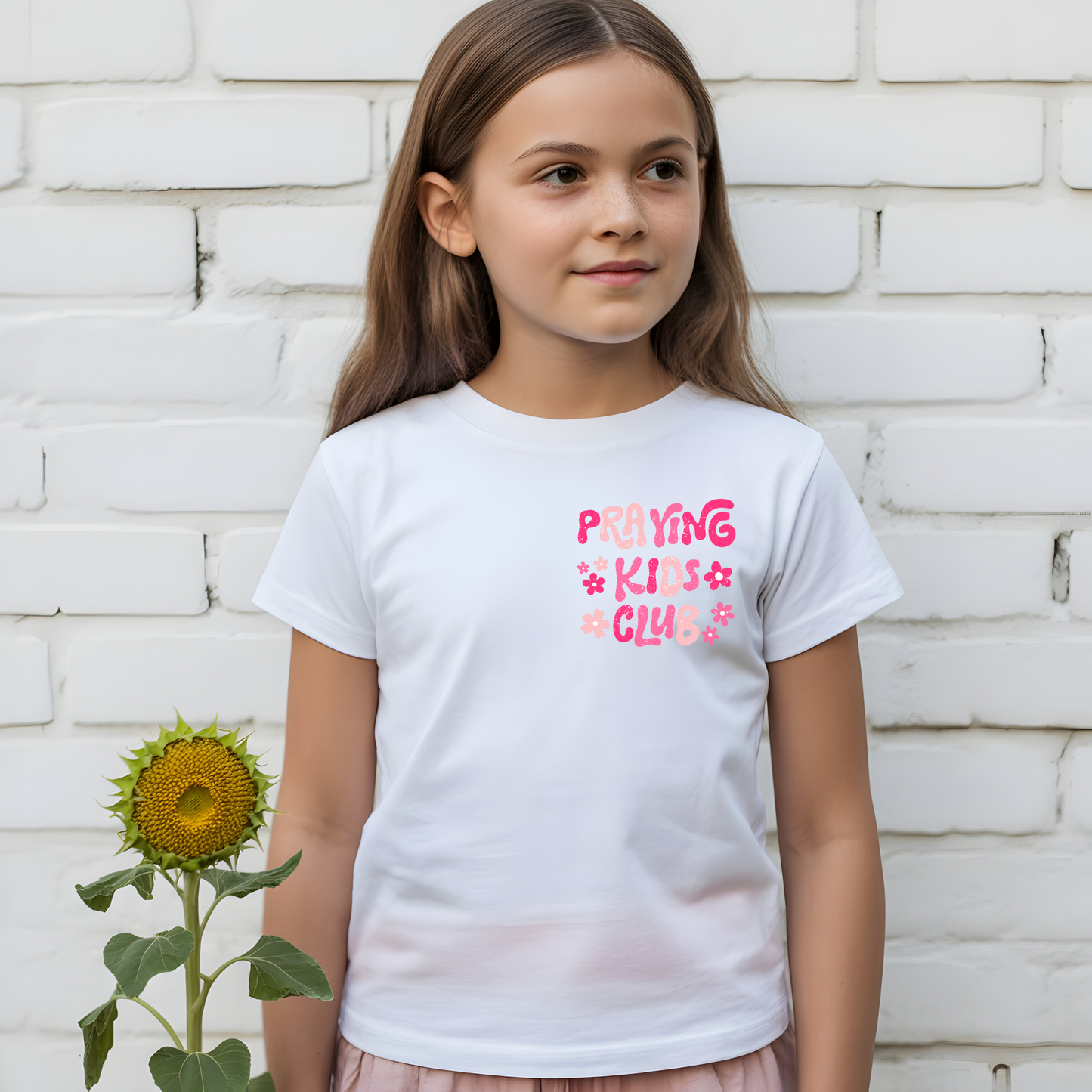 Girl's praying kids club t-shirt from Sons & Daughters with a colorful praying hands graphic on the front.