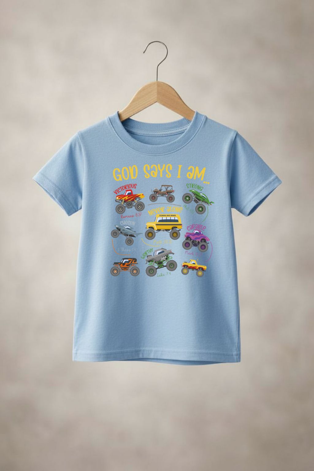 Boy wearing Sons & Daughters "God says" t-shirt with bold text design on a plain background.
