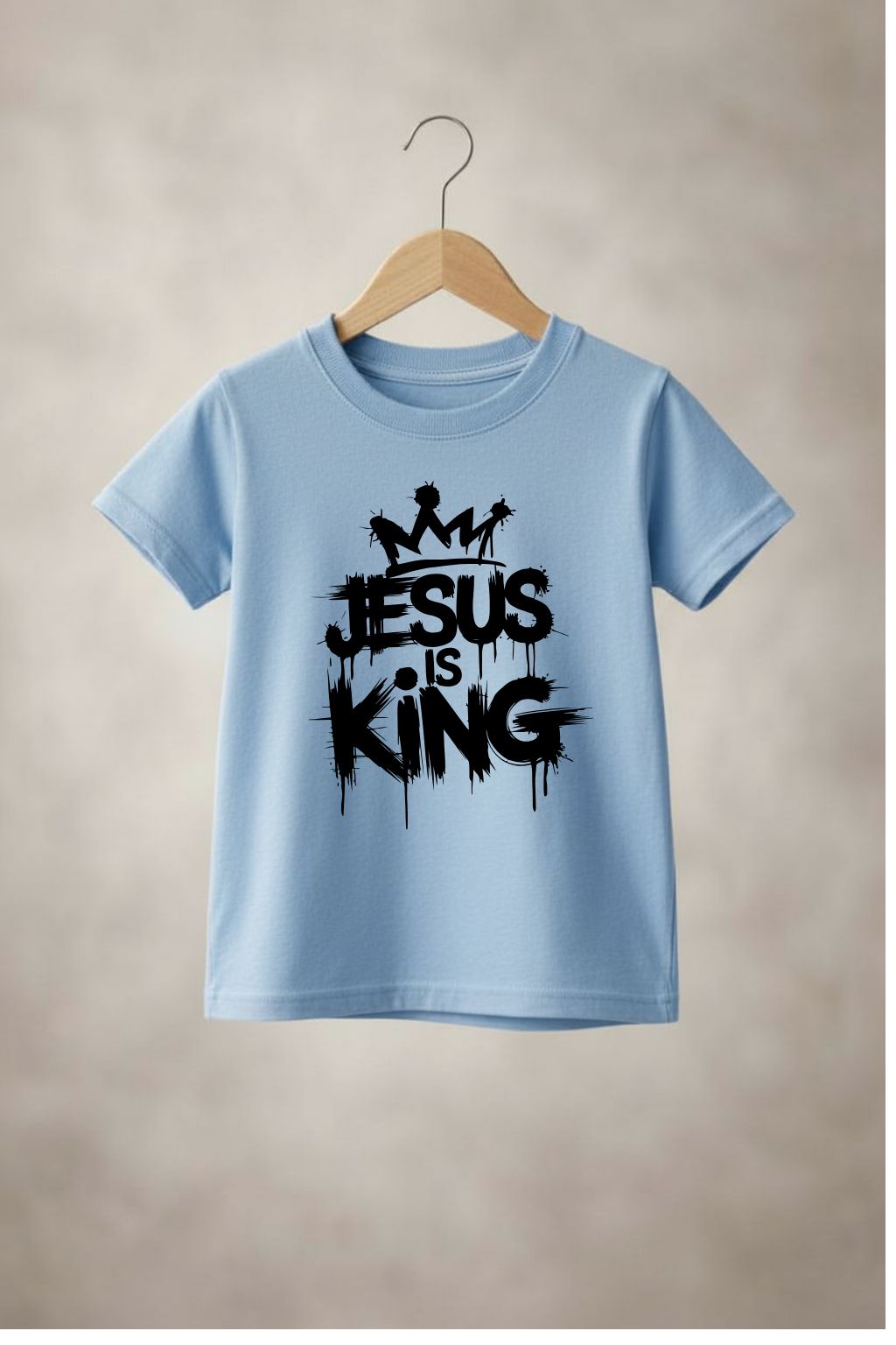 Unisex youth "Jesus is King" T-shirt by Sons & Daughters featuring a graphic design with religious message on soft fabric.