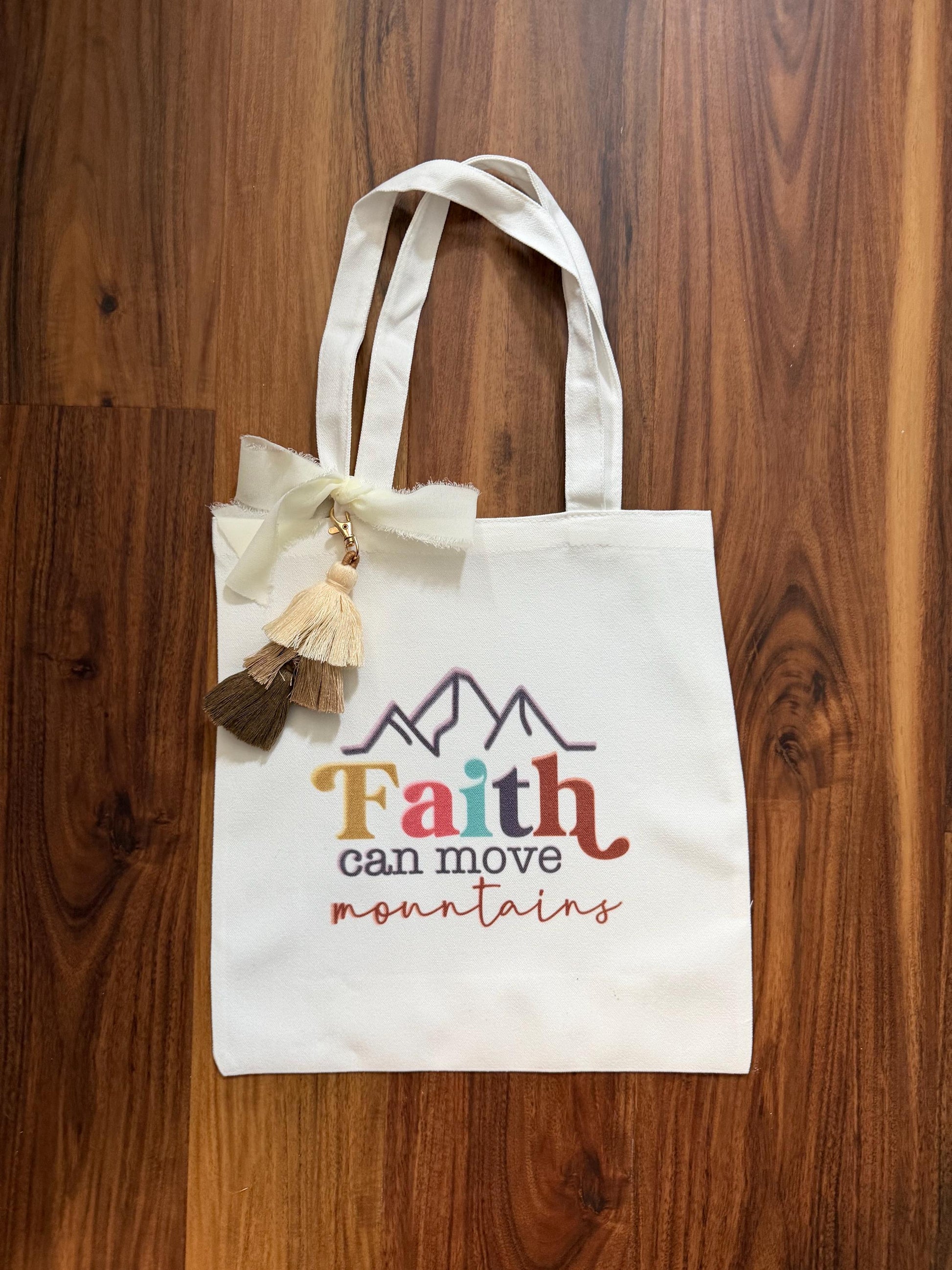 Faith tassel tote bag with vibrant mountain design, canvas Bible verse bag