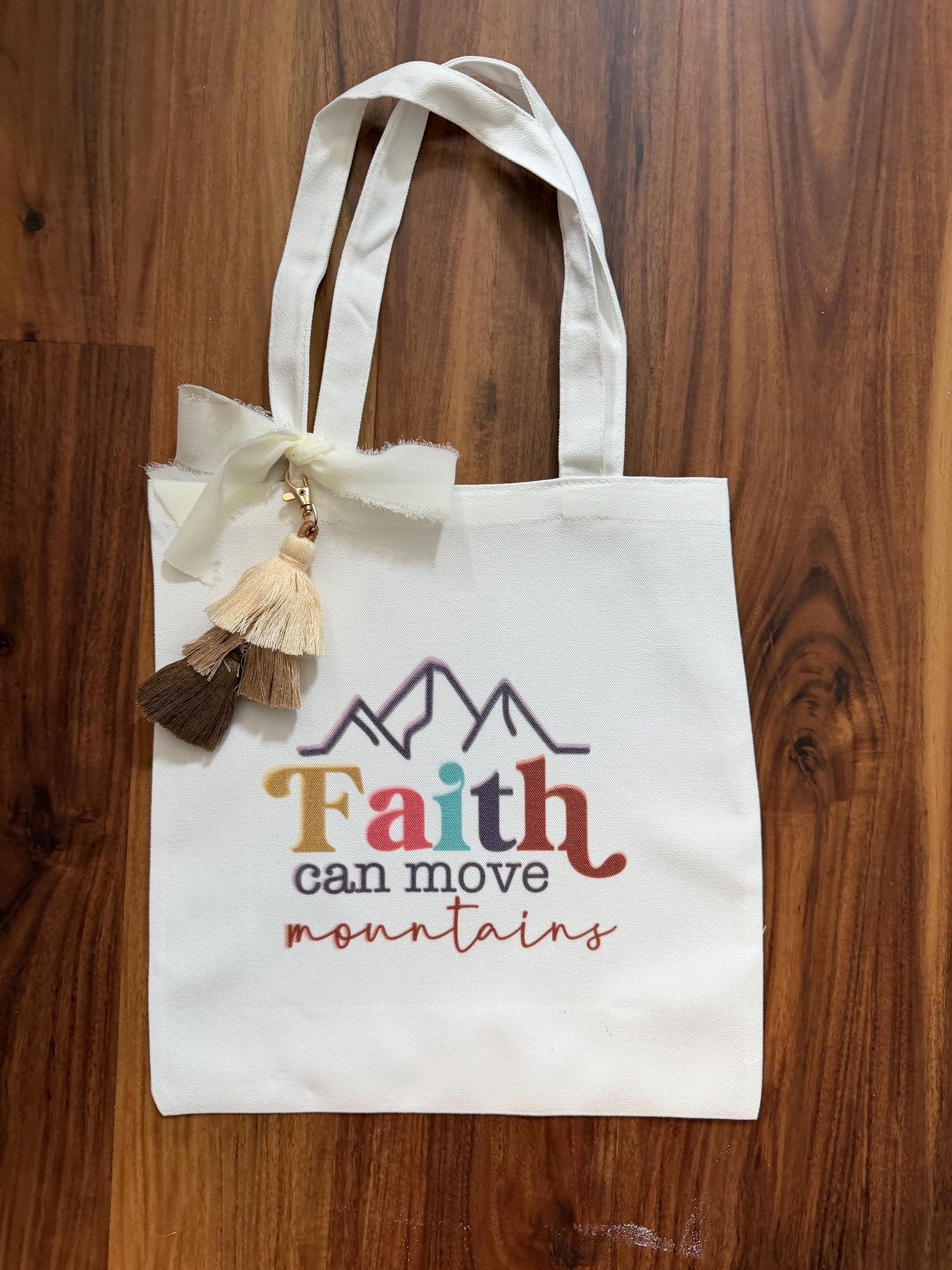Faith tassel tote bag with vibrant mountain design, canvas Bible verse bag