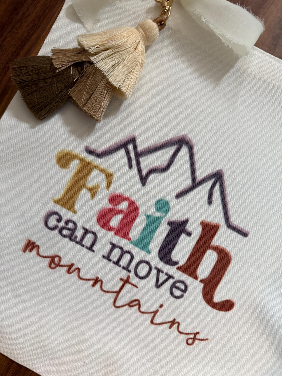 Faith tassel tote bag with vibrant mountain design, canvas Bible verse bag