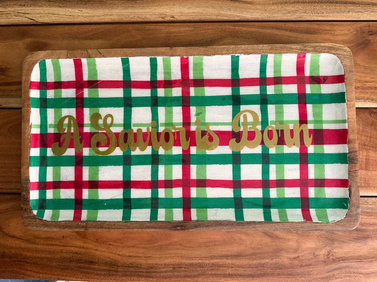 A Savior Is Born acacia wood serving platter by Sons & Daughters with engraved Christmas message