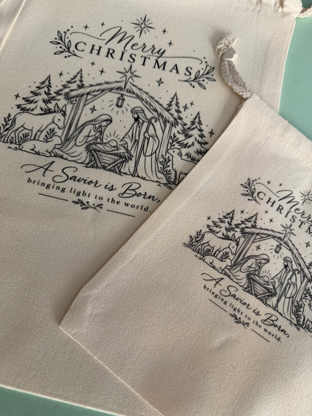 Christmas nativity gift bags by Sons & Daughters featuring a festive nativity scene design