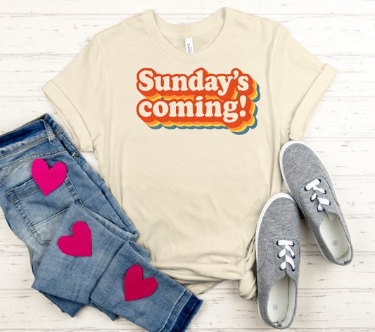 Gray adult T-shirt featuring the "Sunday's Coming" design by Sons & Daughters, with short sleeves and a comfortable fit.
